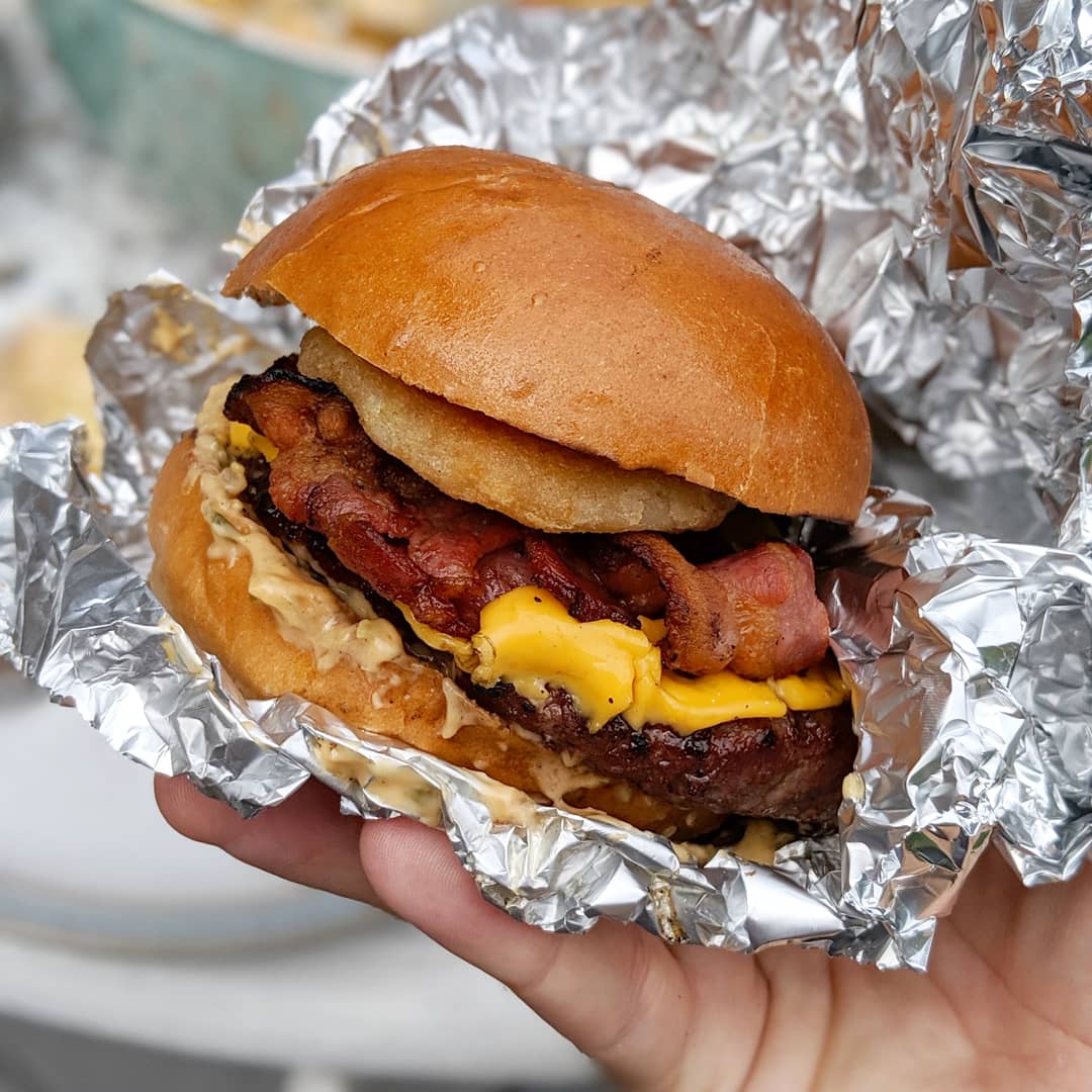 Homemade BBQ smashed burgers. With double cheese, bacon, onion rings