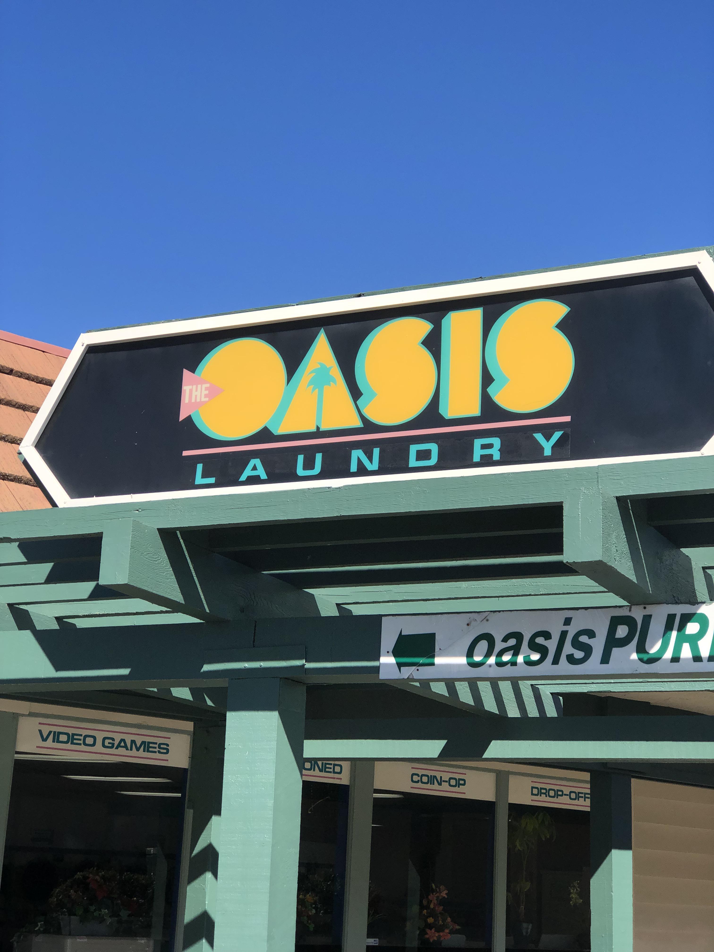 Laundromat near my house has a neat sign. r/outrun