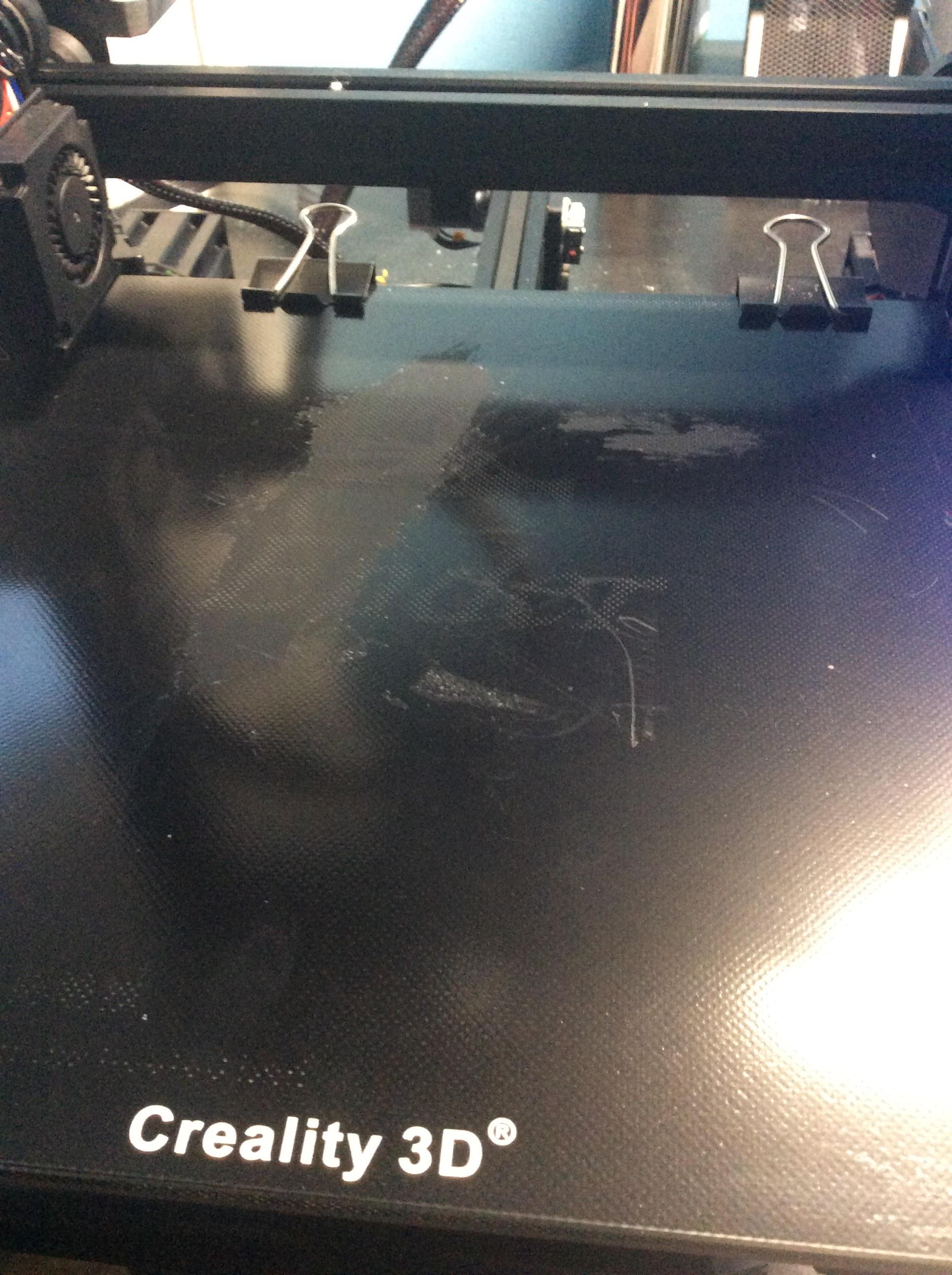 How to clean this gook off my enter 3 glass? I tried scrubbing it with