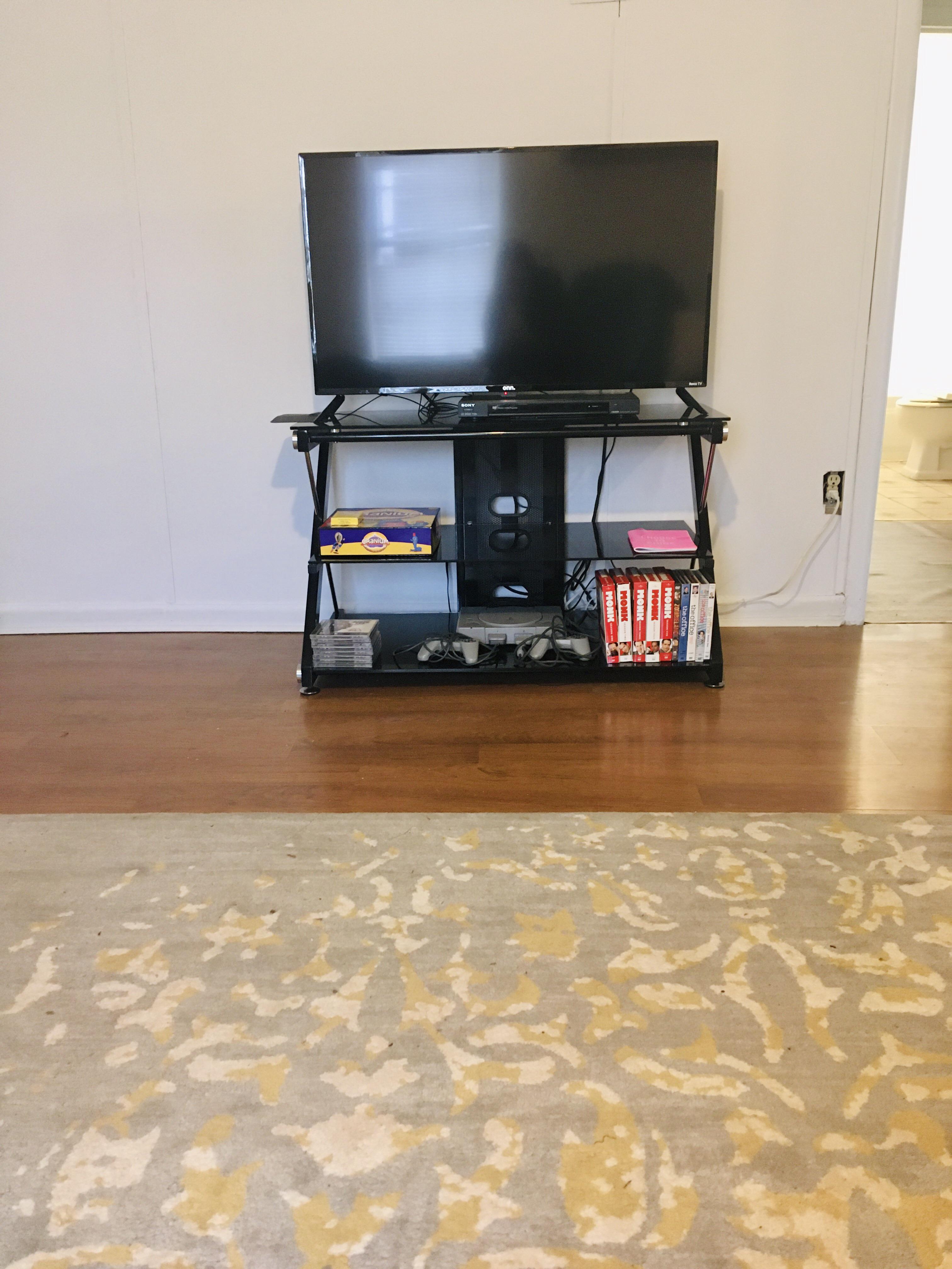 Rug and TV stand found on the side of the road on trash day! Cleaned up