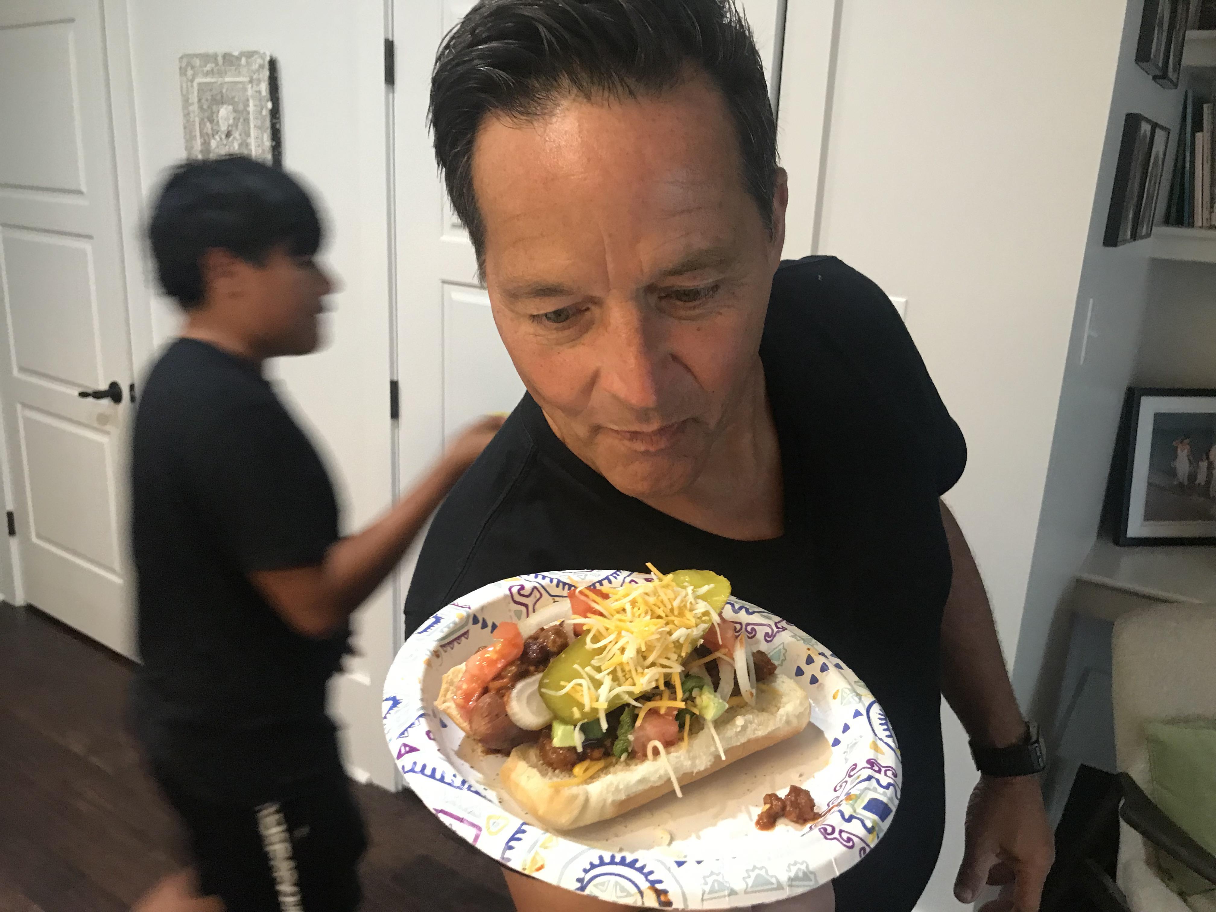 He loves his chili dog. r/pics
