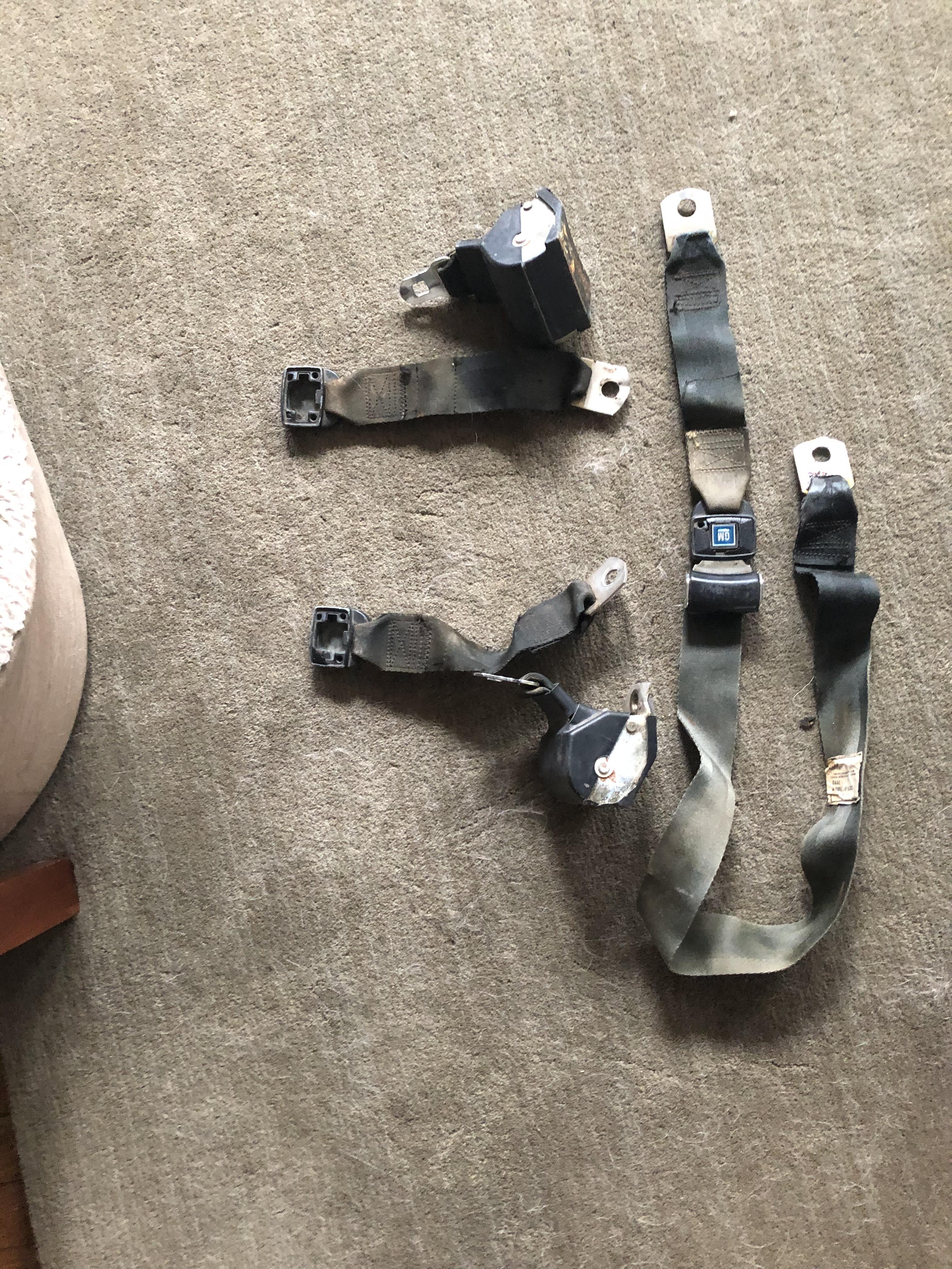 Finally got the old worn out seat belts out(well I got the back ones at