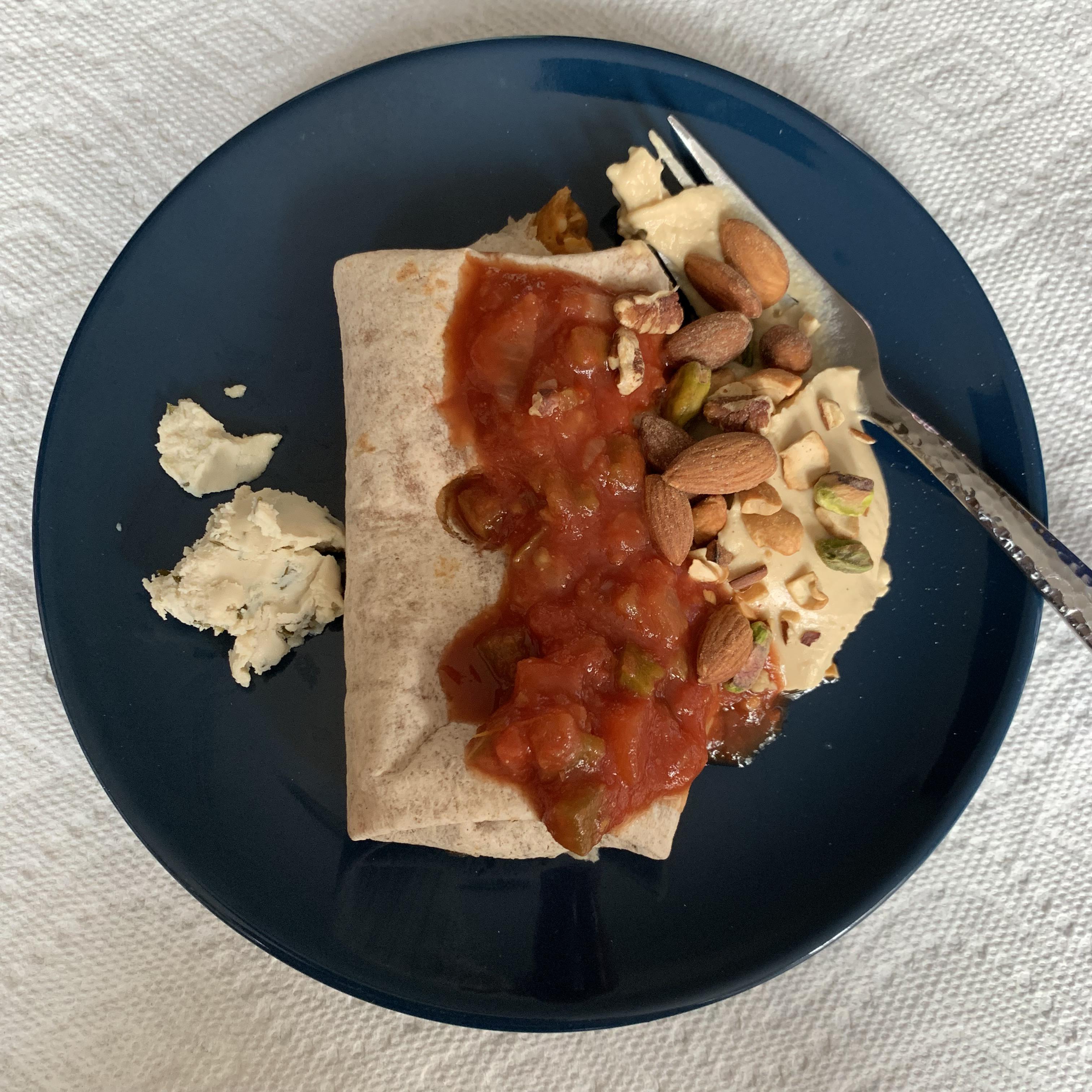 Amy’s burrito with salsa, hummus, mixed nuts, and one plop of vegan