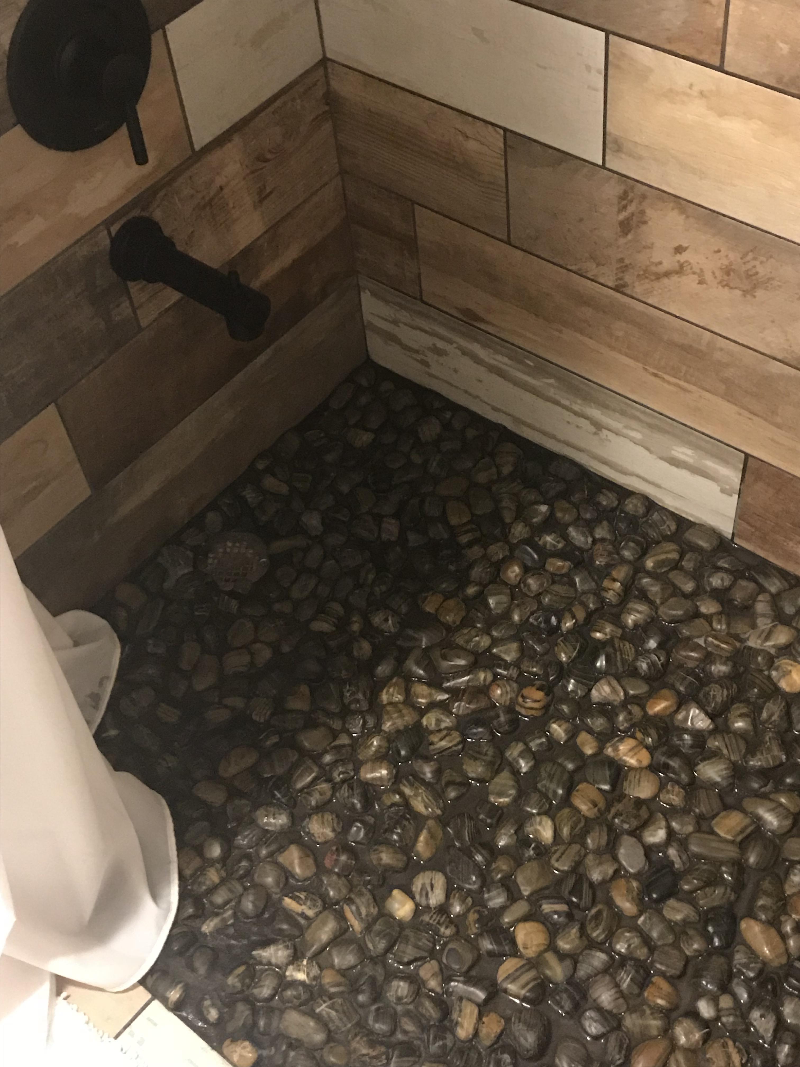 This shower floor made of rocks. r/CrappyDesign