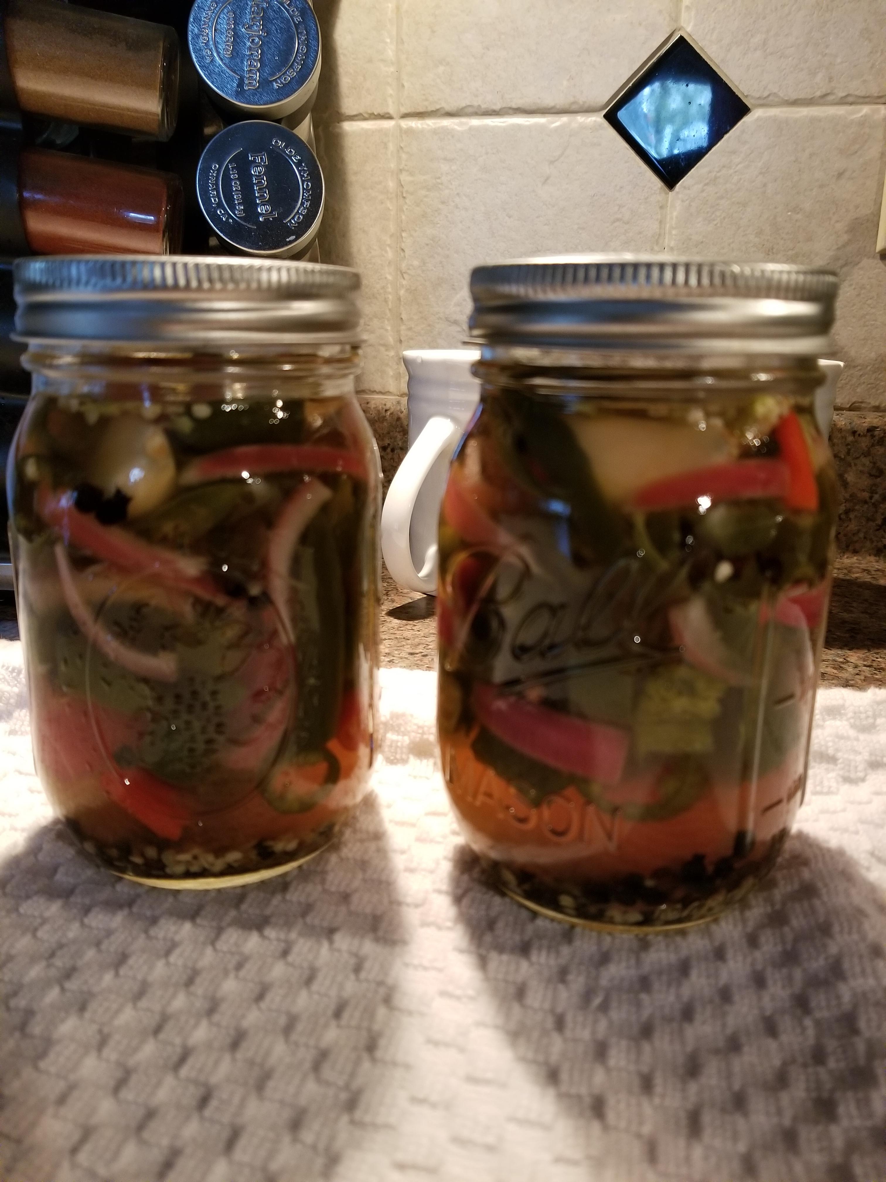 Pickled and canned the remaining hot peppers from the garden, threw in