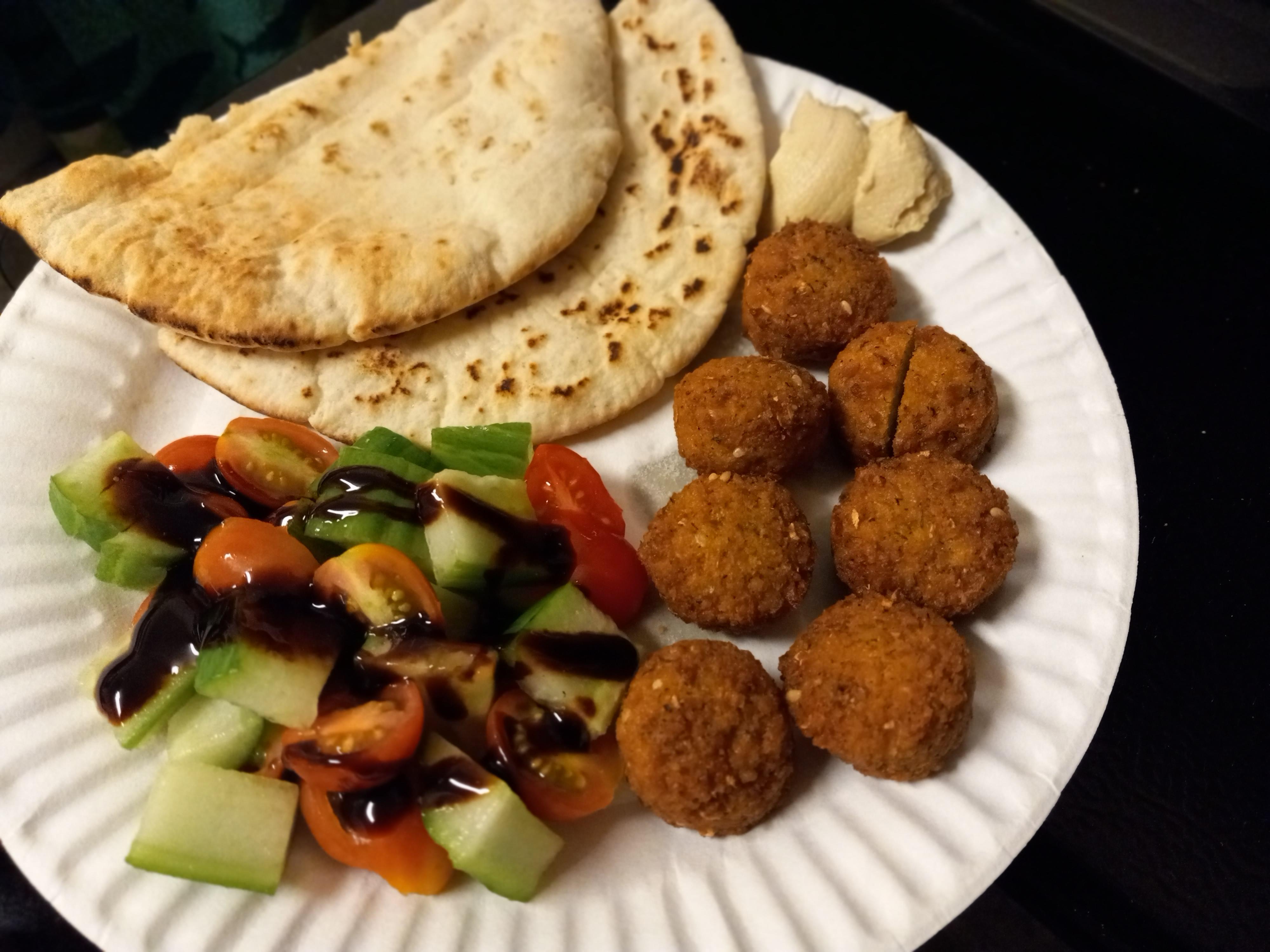 Trader joes mini dill pickle falafel, pita, tomatoes and cucumber with