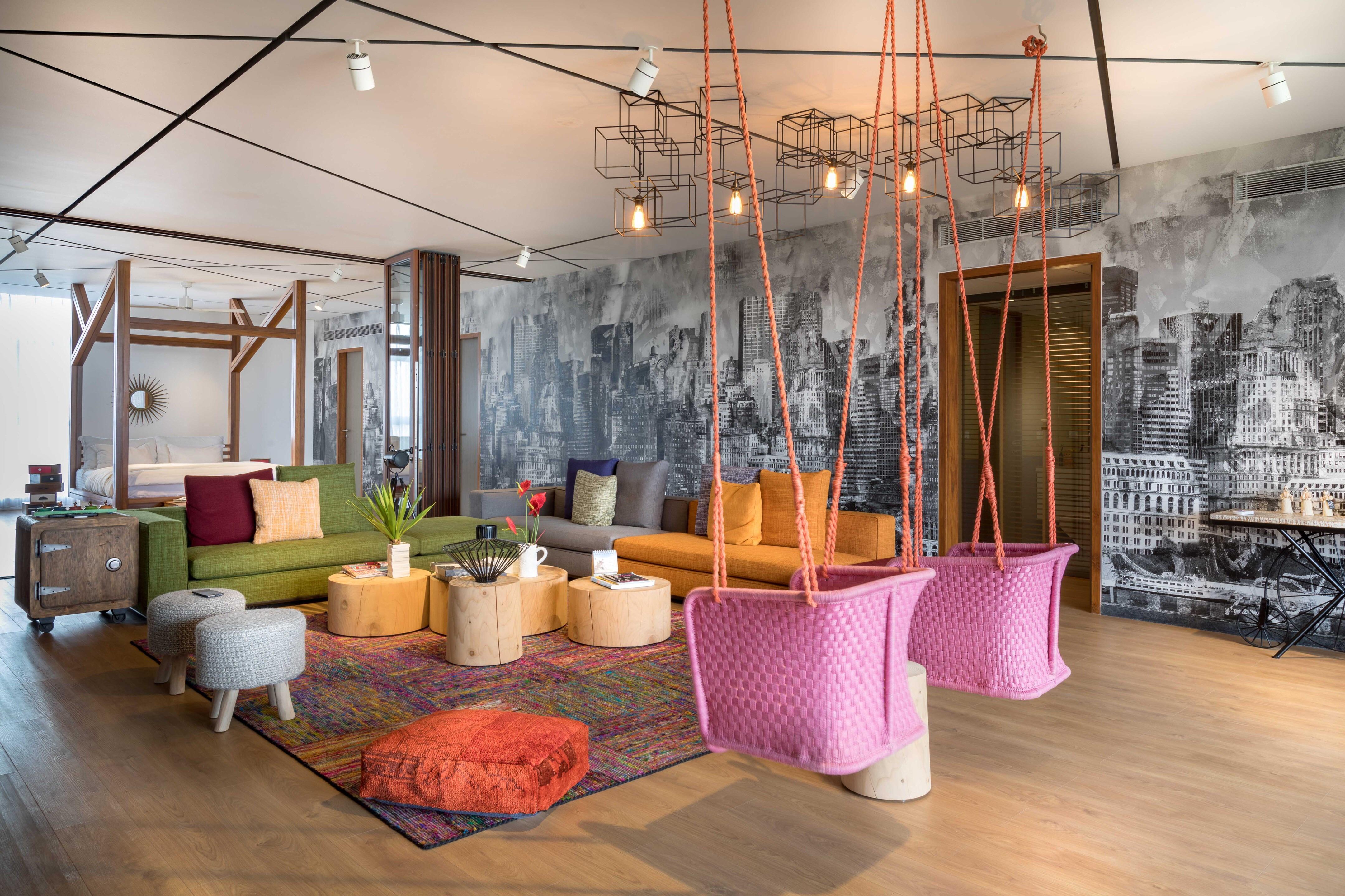 Colorful studio apartment with city skyline wallpaper in Hyderabad