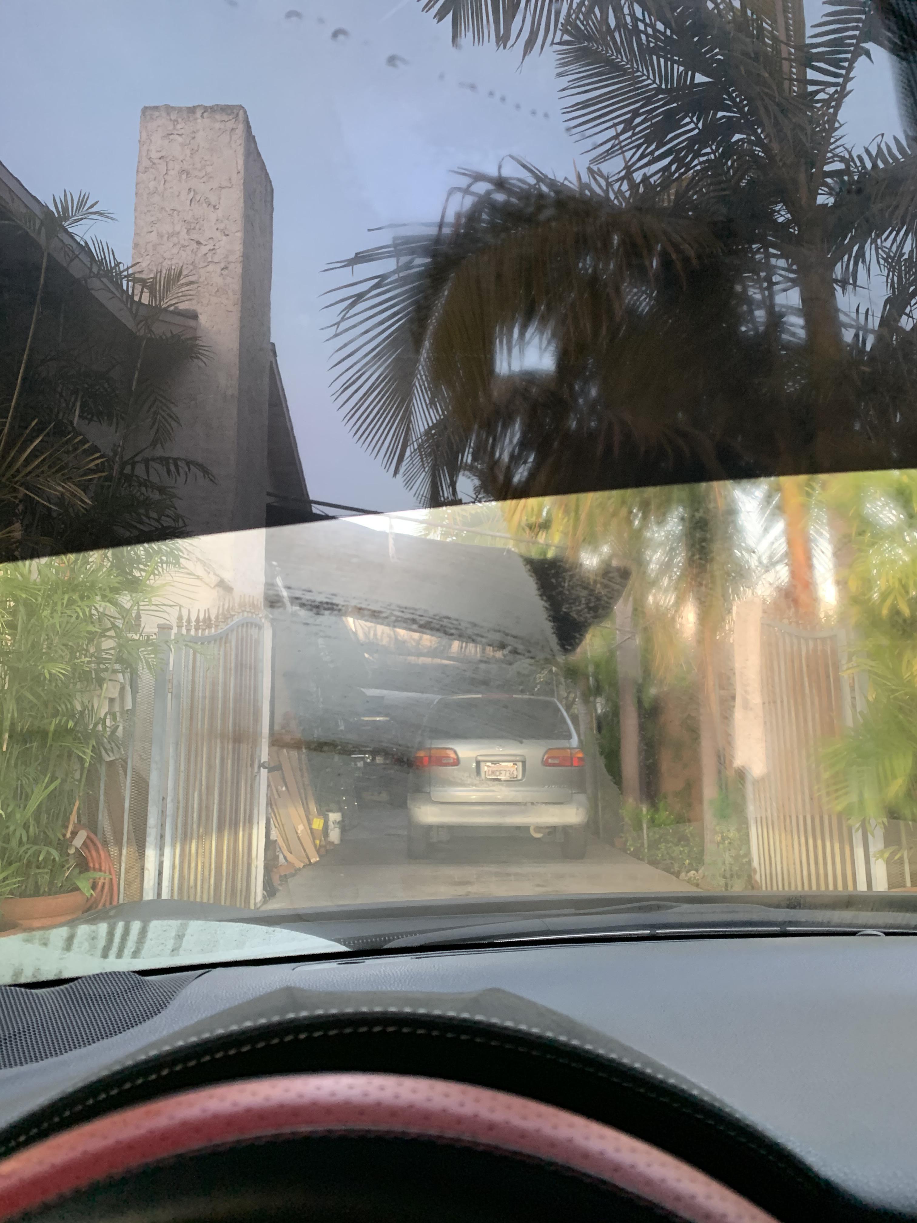 Anybody know what may be stuck to my windshield? I tried removing it