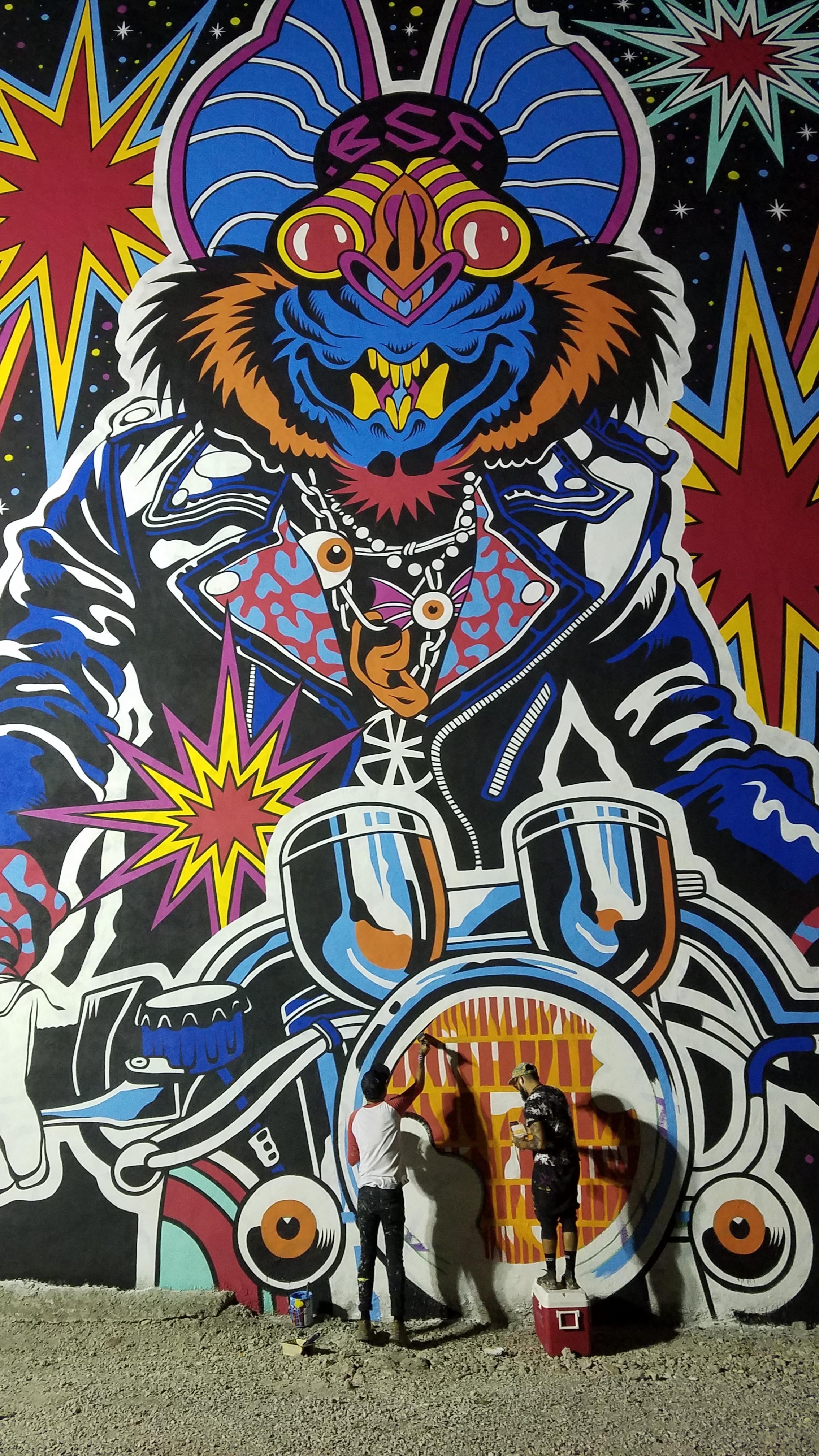 These guys painting mural on the side of a building for a festival in Cincinnati. r