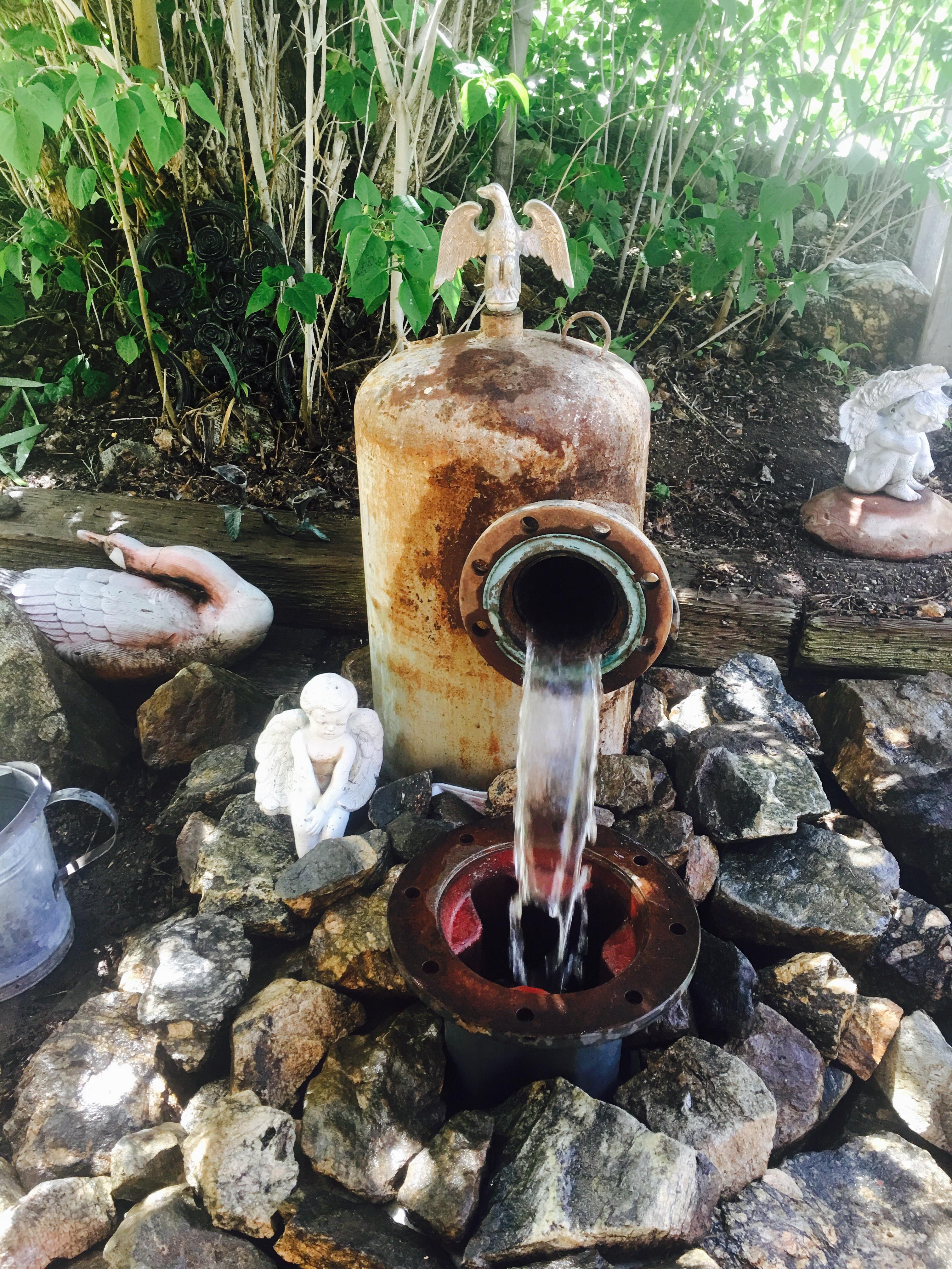 A water fountain I put together out of recycled materials. r/landscaping