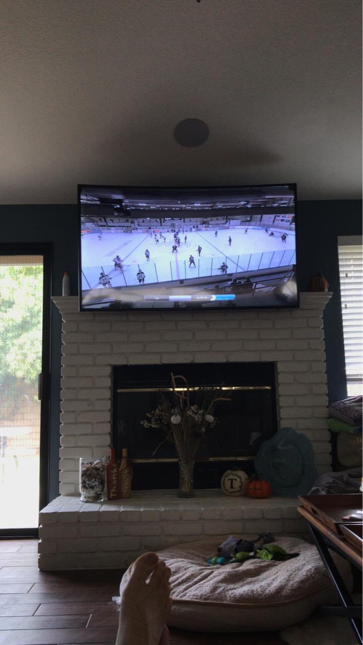 Hockey TV. Way too high above painted brick. And it overhangs the