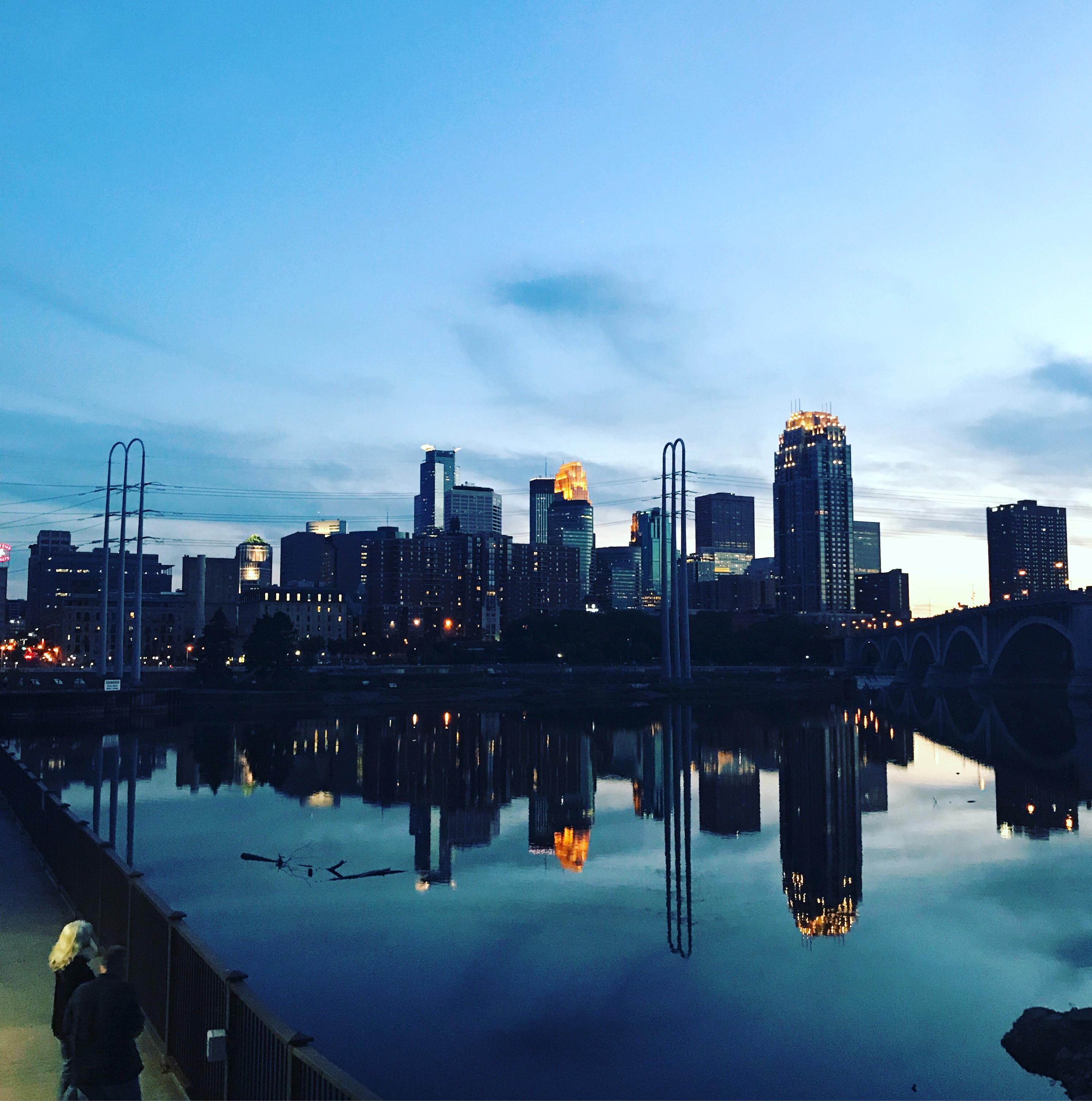 Minneapolis skyline reflecting off the Mississippi River. r/Minneapolis