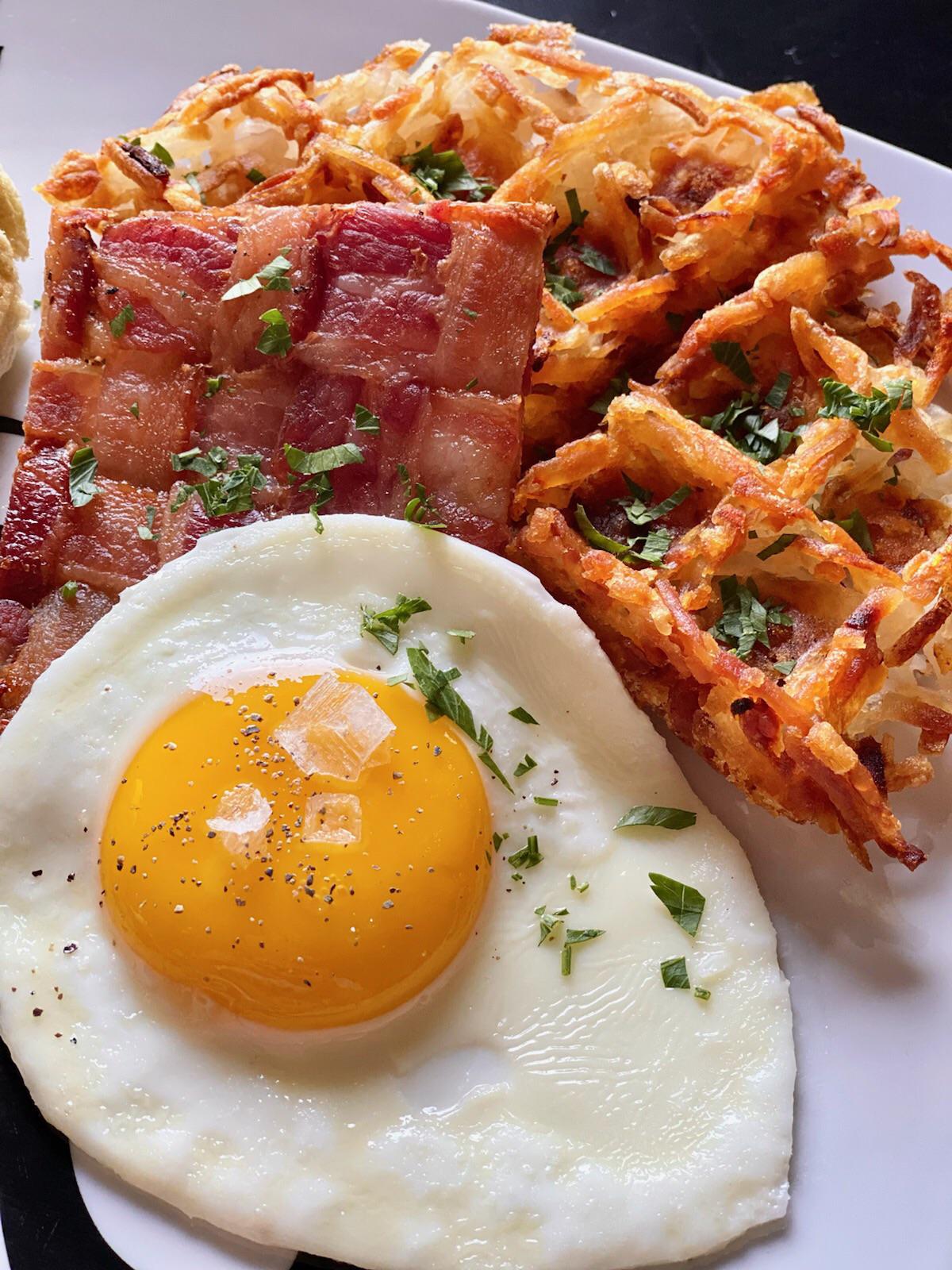 Waffle hash brown, maple bacon weave, and a sunny side egg r/FoodPorn