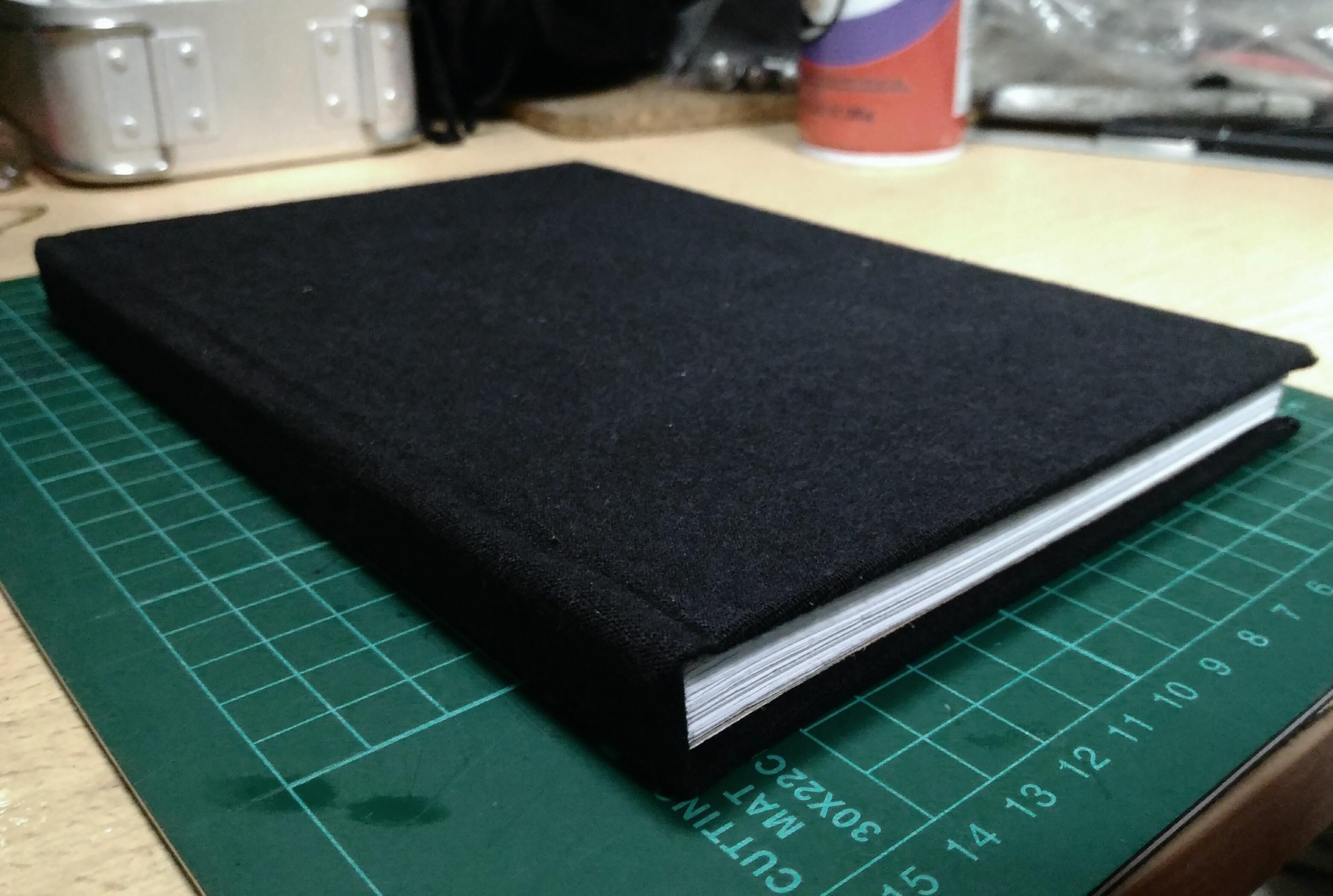 First attempt at bookbinding. Cover fabric is recycled from a black tee