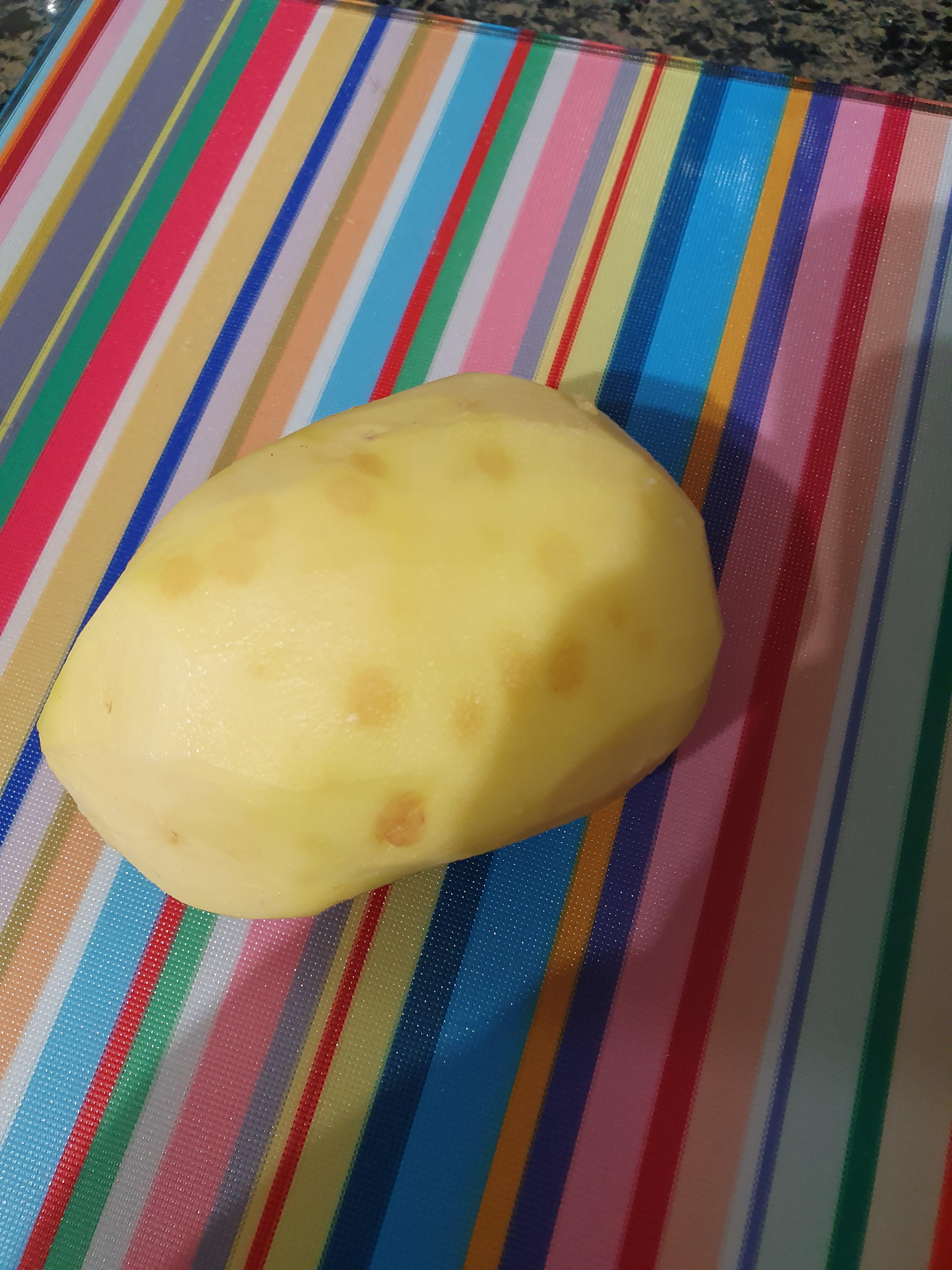 just peeled a potato and found that its covered in these spots, is it