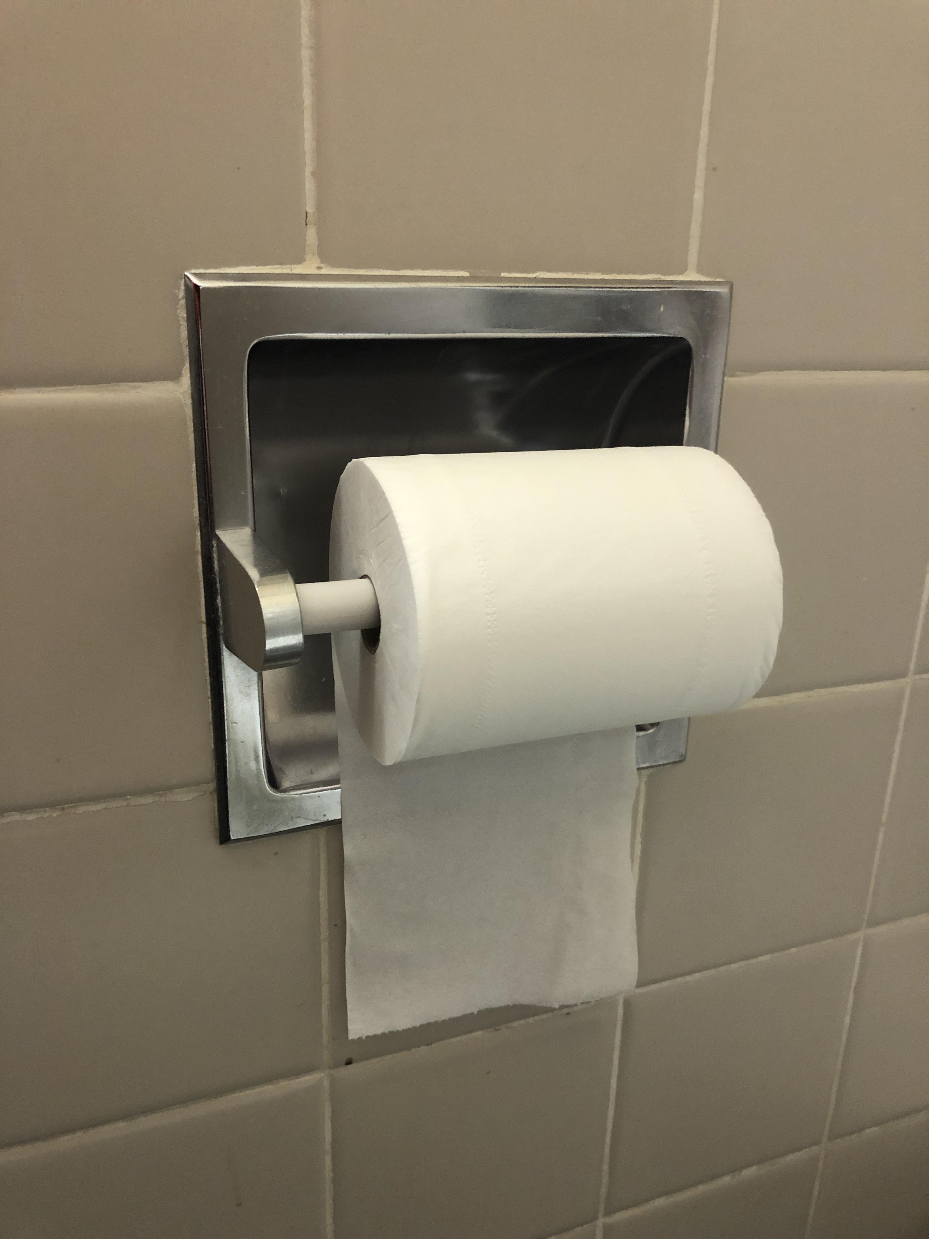 This is in a hospital. The toilet paper roll is locked in with a