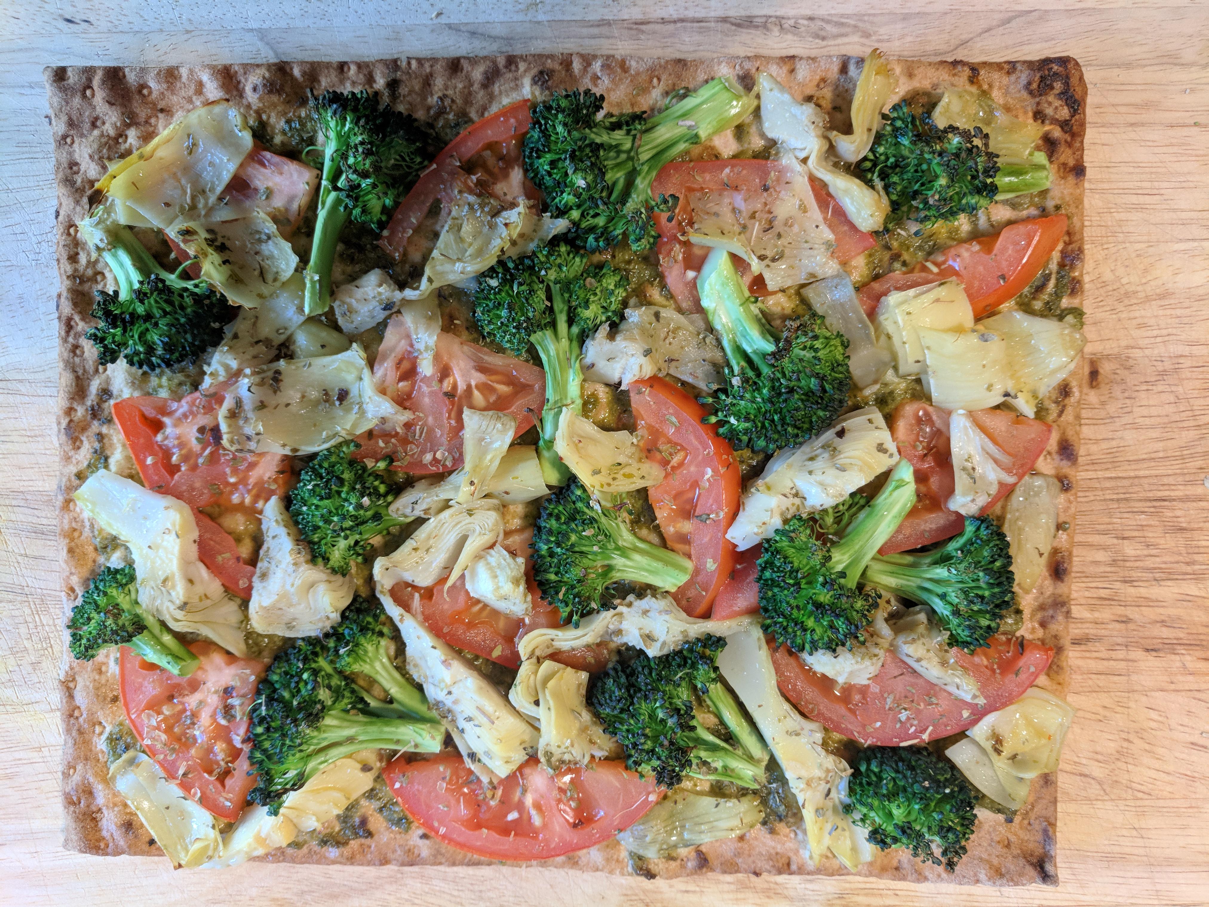 Flatbread pizza Pesto, tomato, artichoke, broccoli, whole wheat, lavash, fresh basil (350