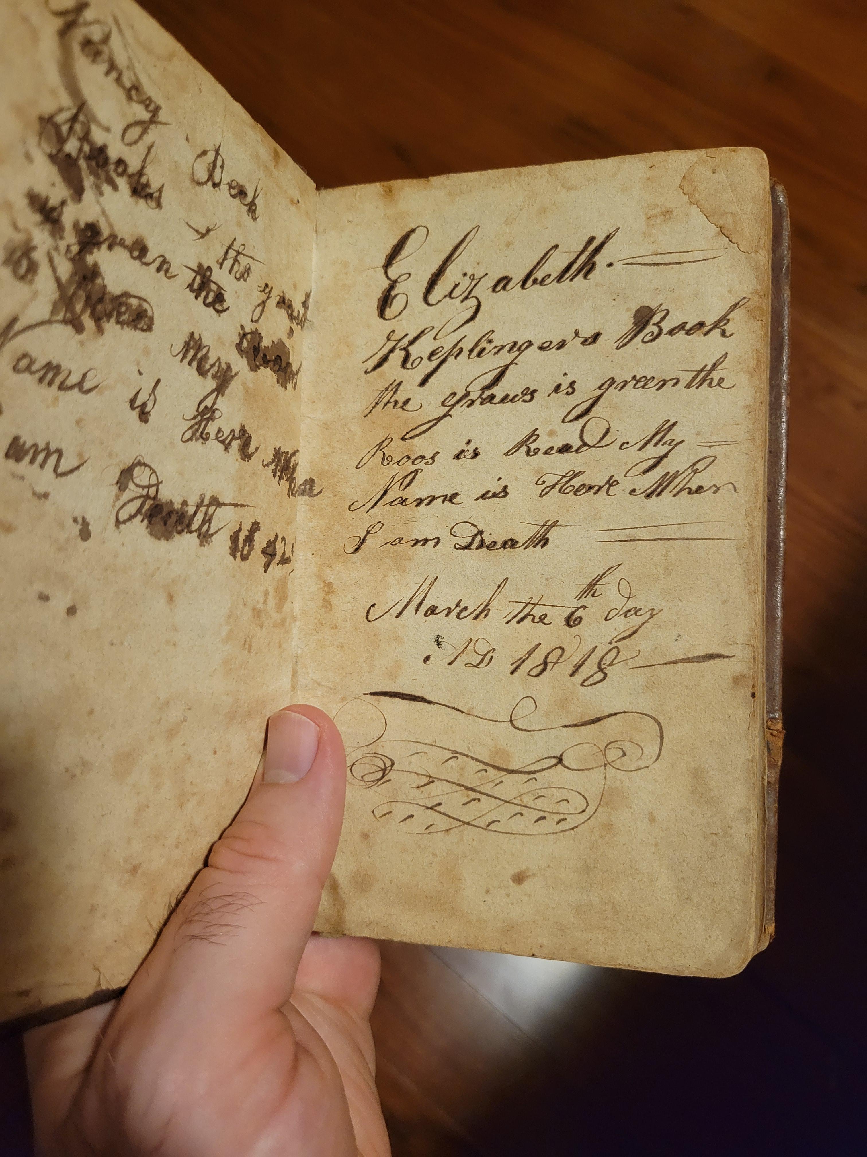 I bought a few very old books at auction, and I found this in a book of