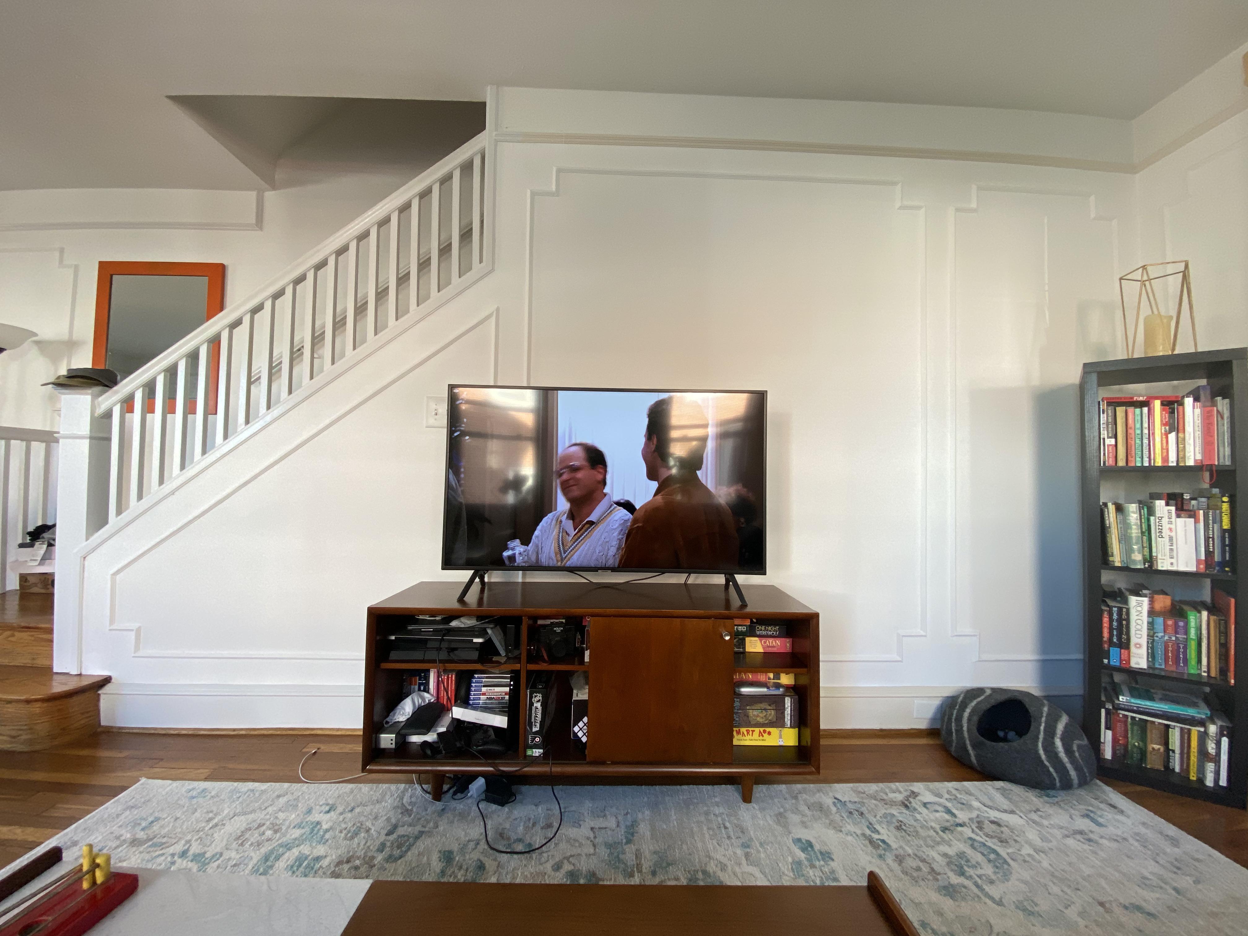 How do we position the TV on this wall? The millwork and couch