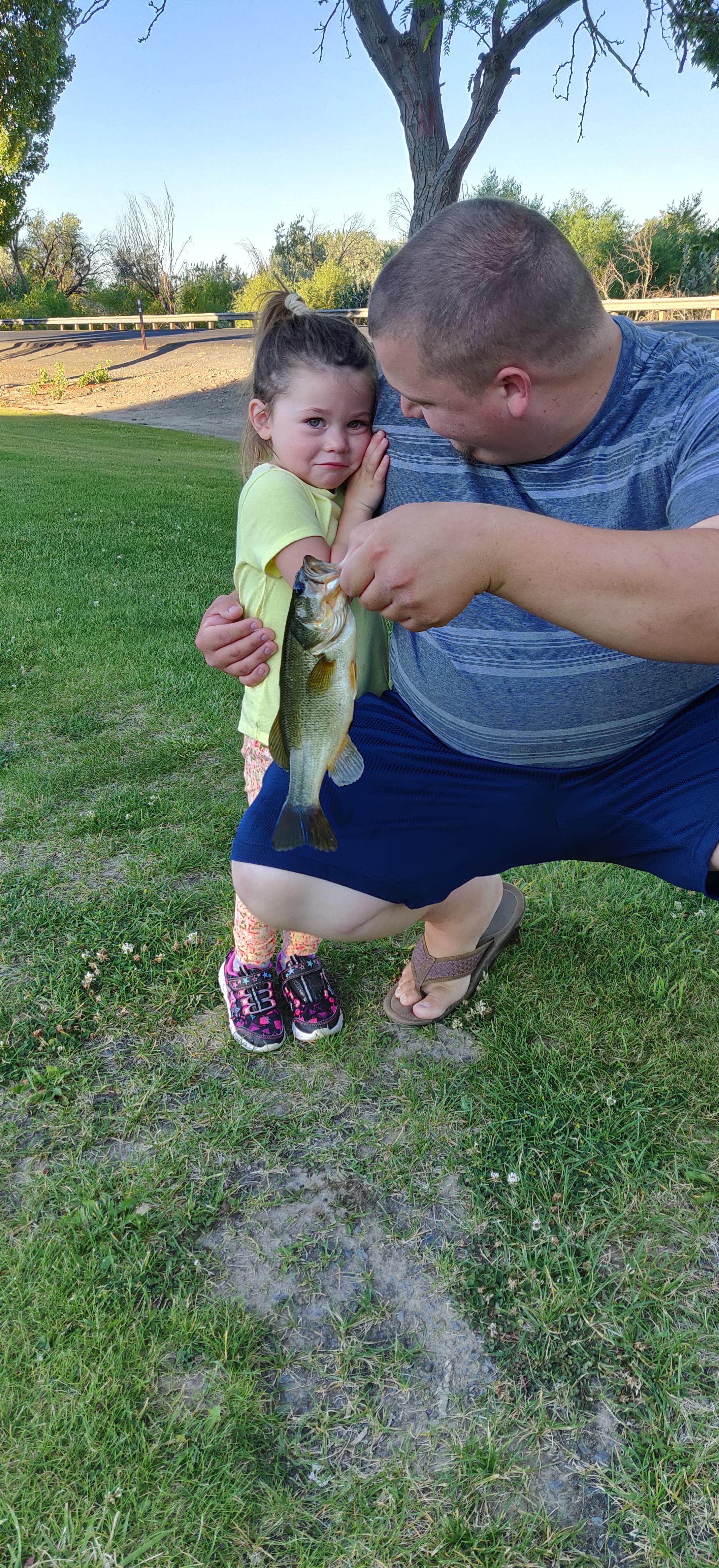 Daughter caught her first fish today, she was afraid to hold it for the