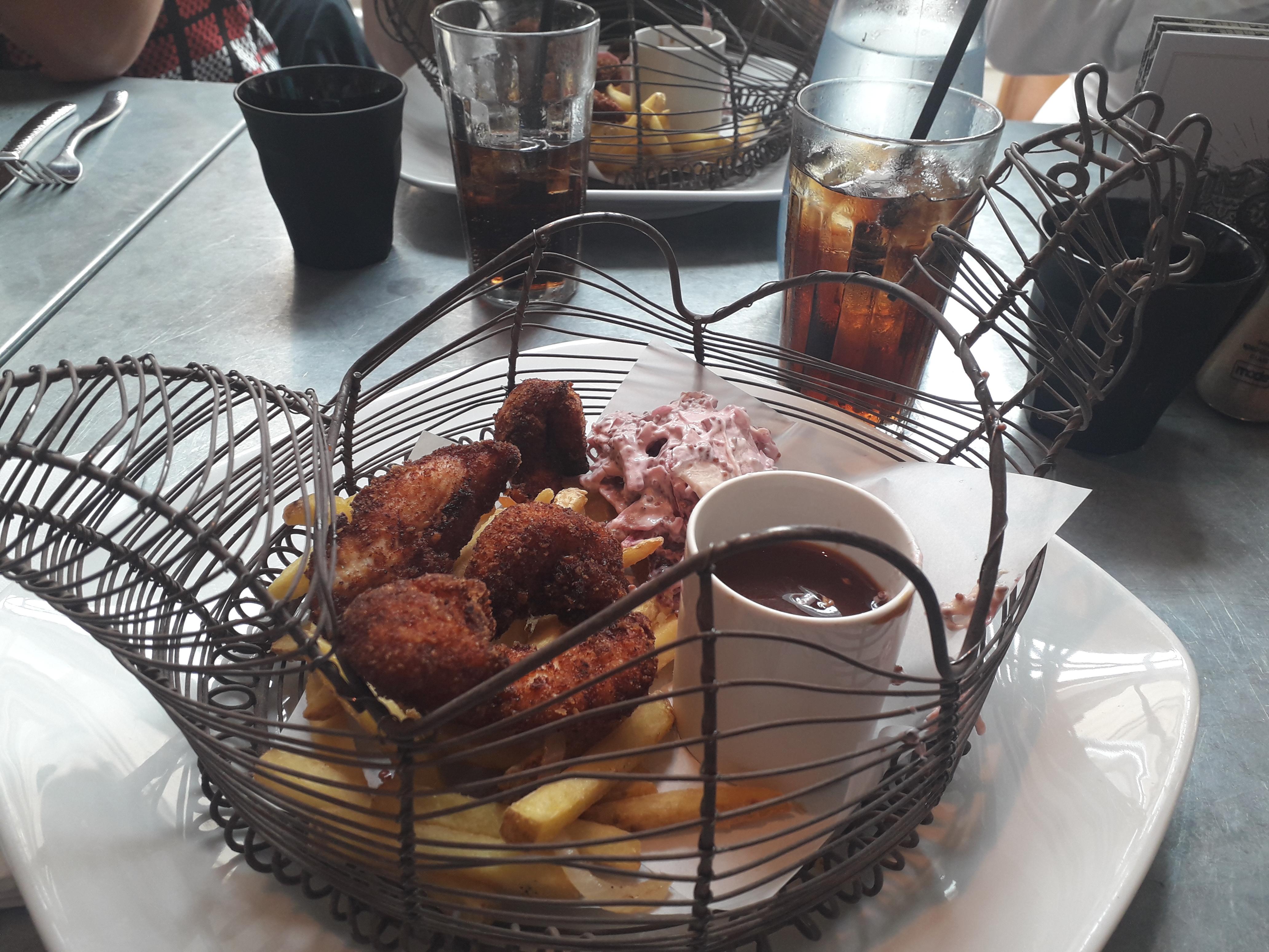 Chicken in a basket. Literally. On a pointless plate. Access with