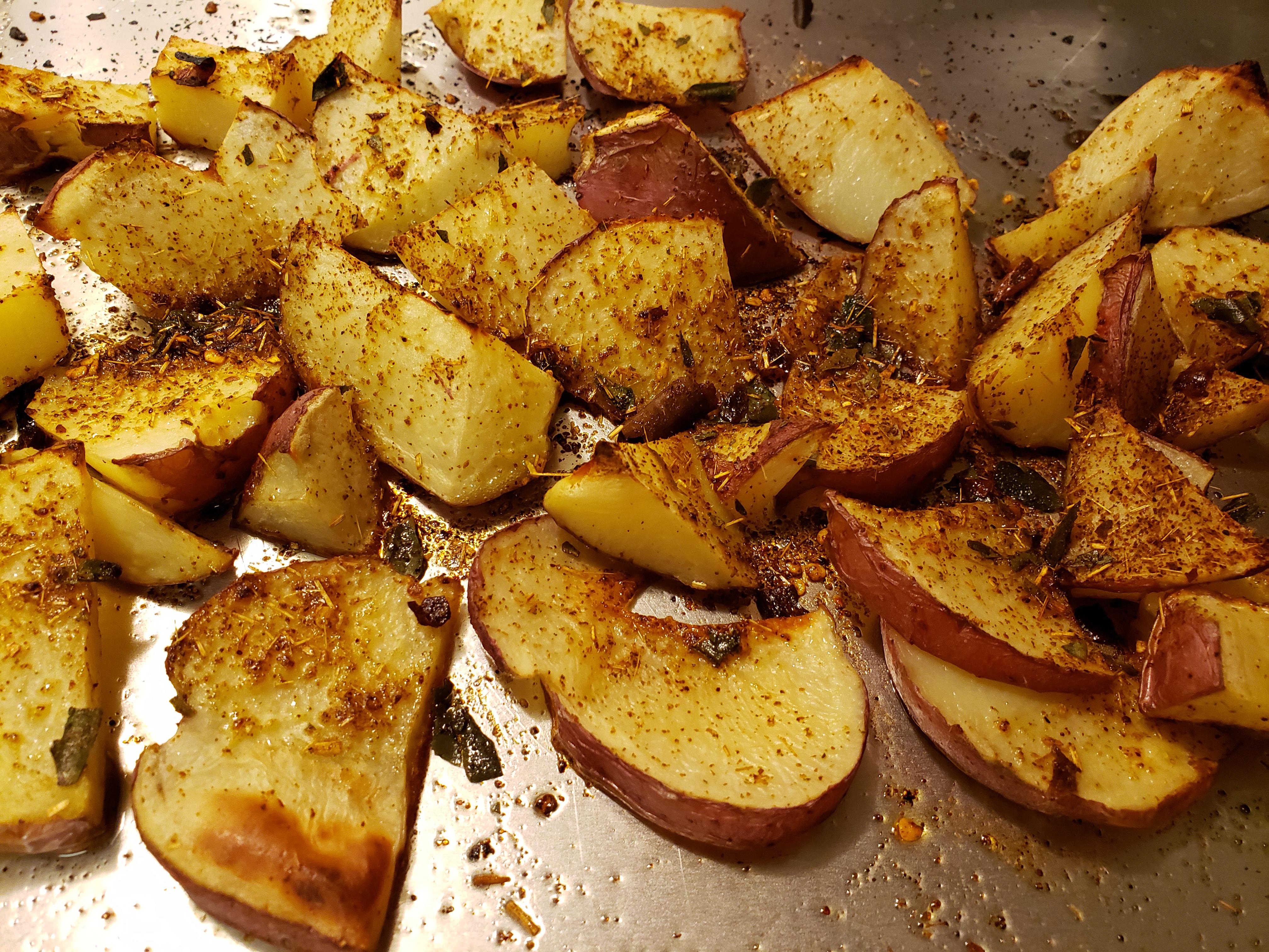 Ovenroasted red potatoes with olive oil and various herbs and spices