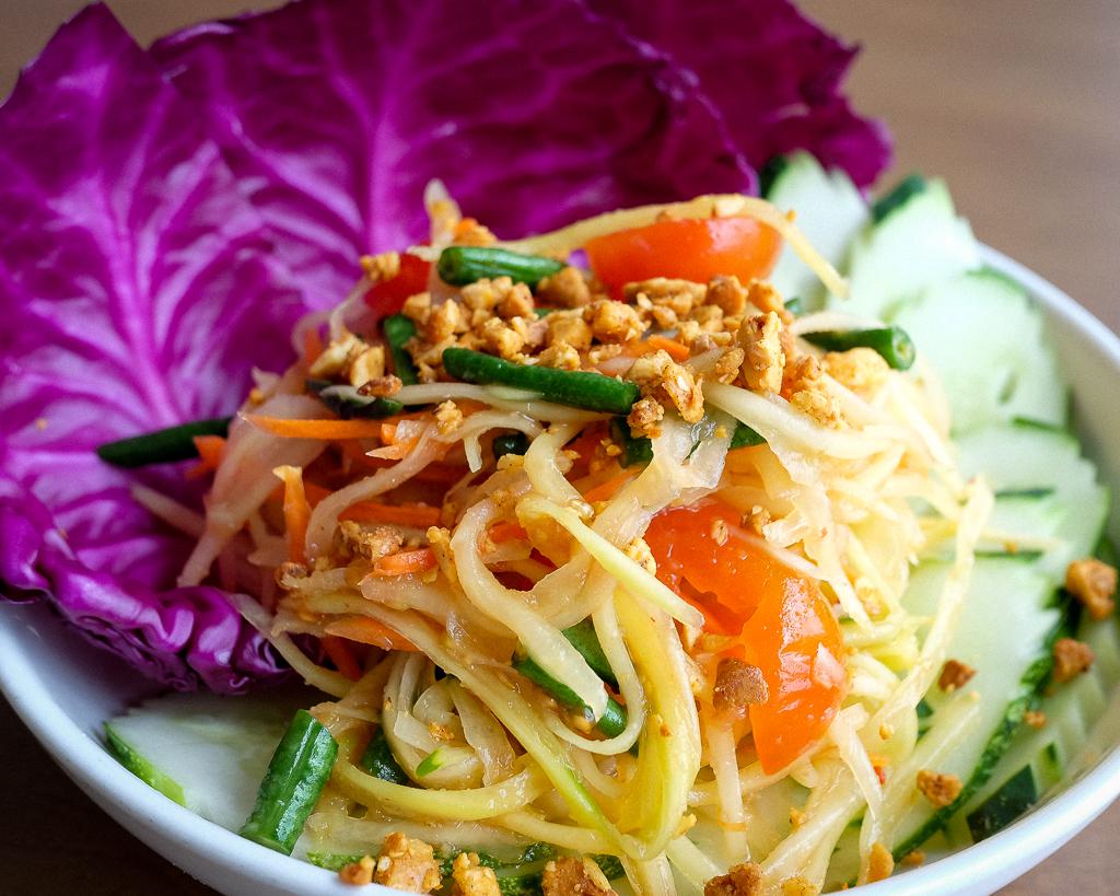 Green Papaya Salad with Long Beans, Tomatoes, Carrots. Smashed into a