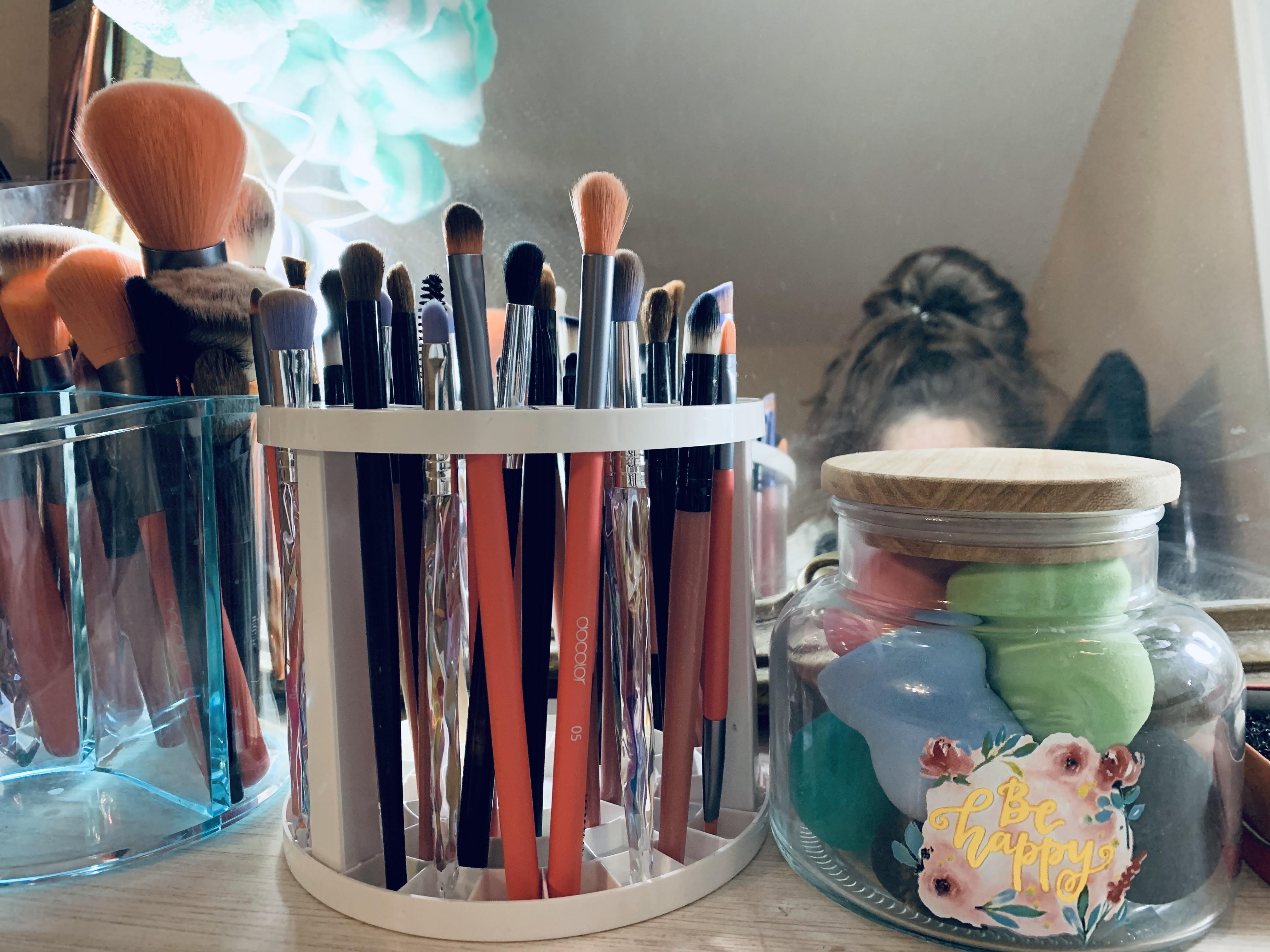 The Dollar Tree paintbrush holder carousels are PERFECT for holding makeup brushes. I wish I had