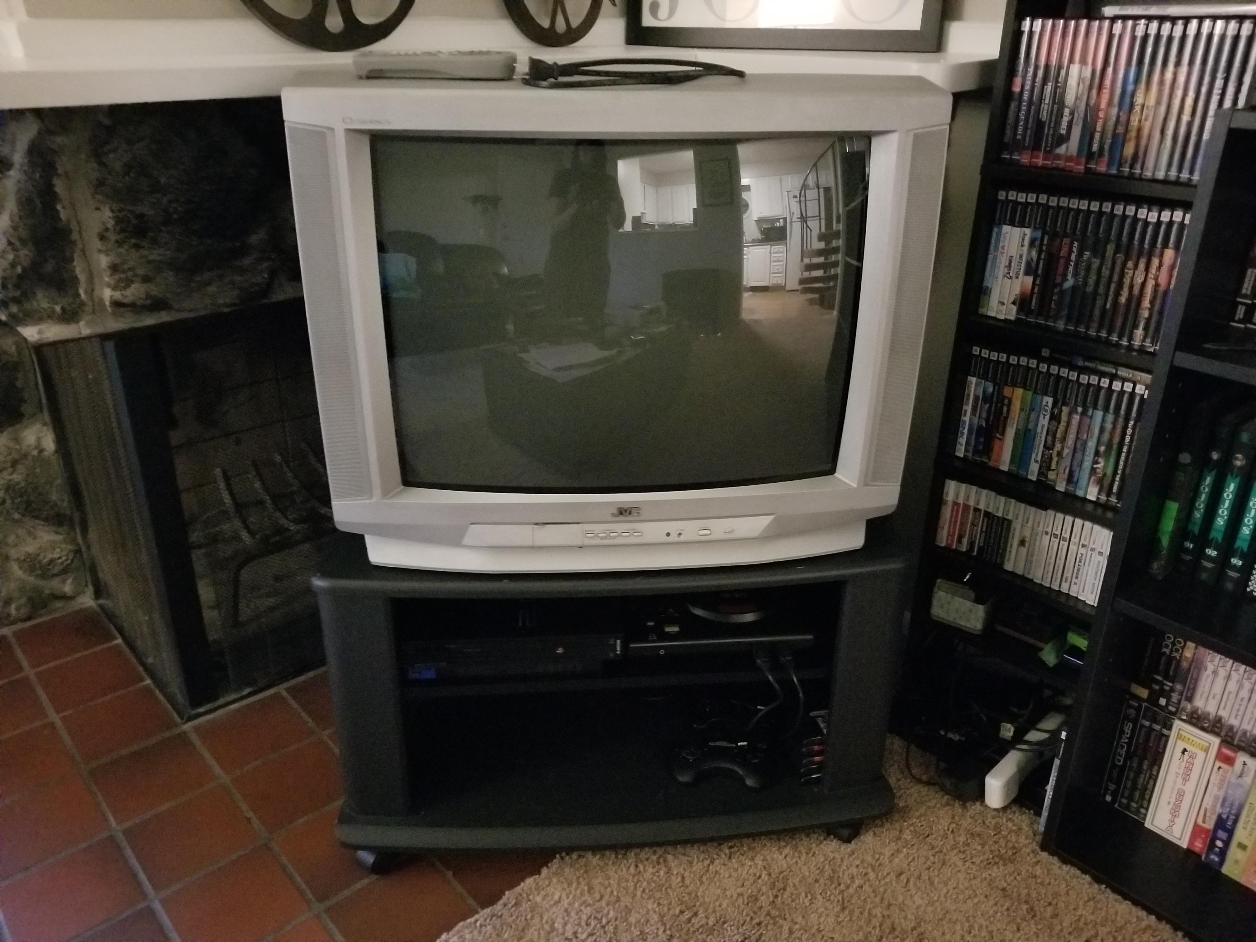 Finally found a tv stand for her. PS2 and Genesis blending in to thier