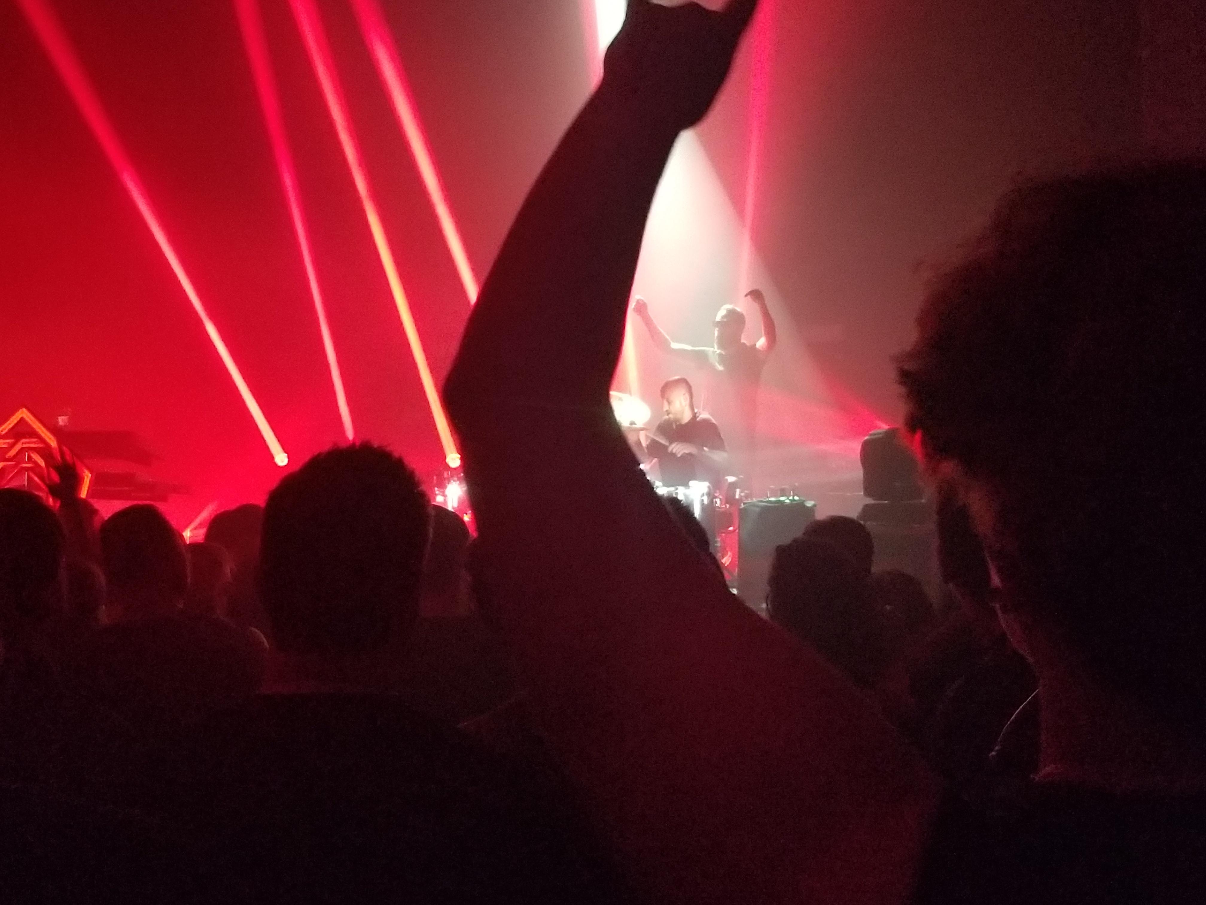 Franck encouraging the audience to cheer for the drummer tonight at the