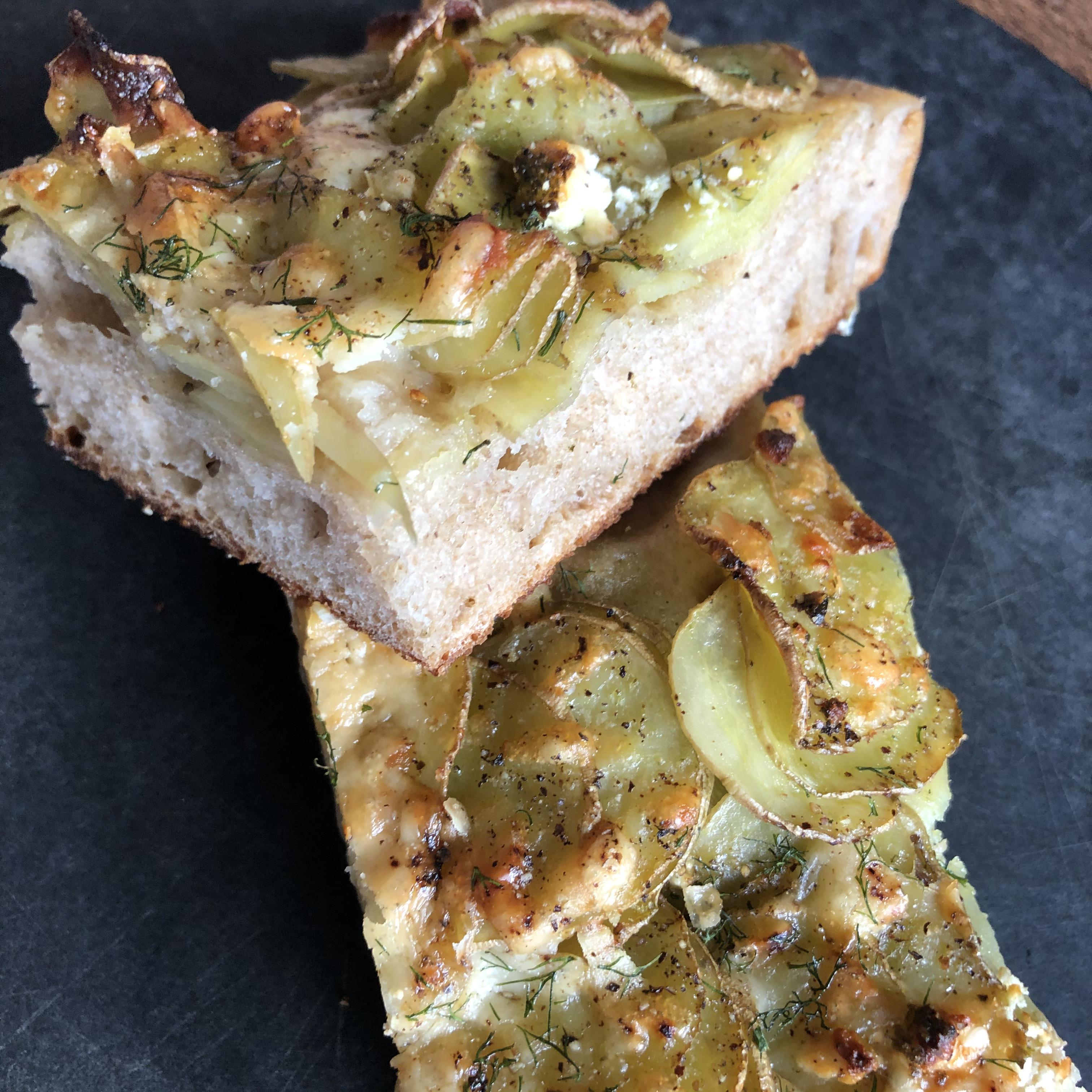 Sourdough potato focaccia with fresh dill, goat cheese and wild ramp