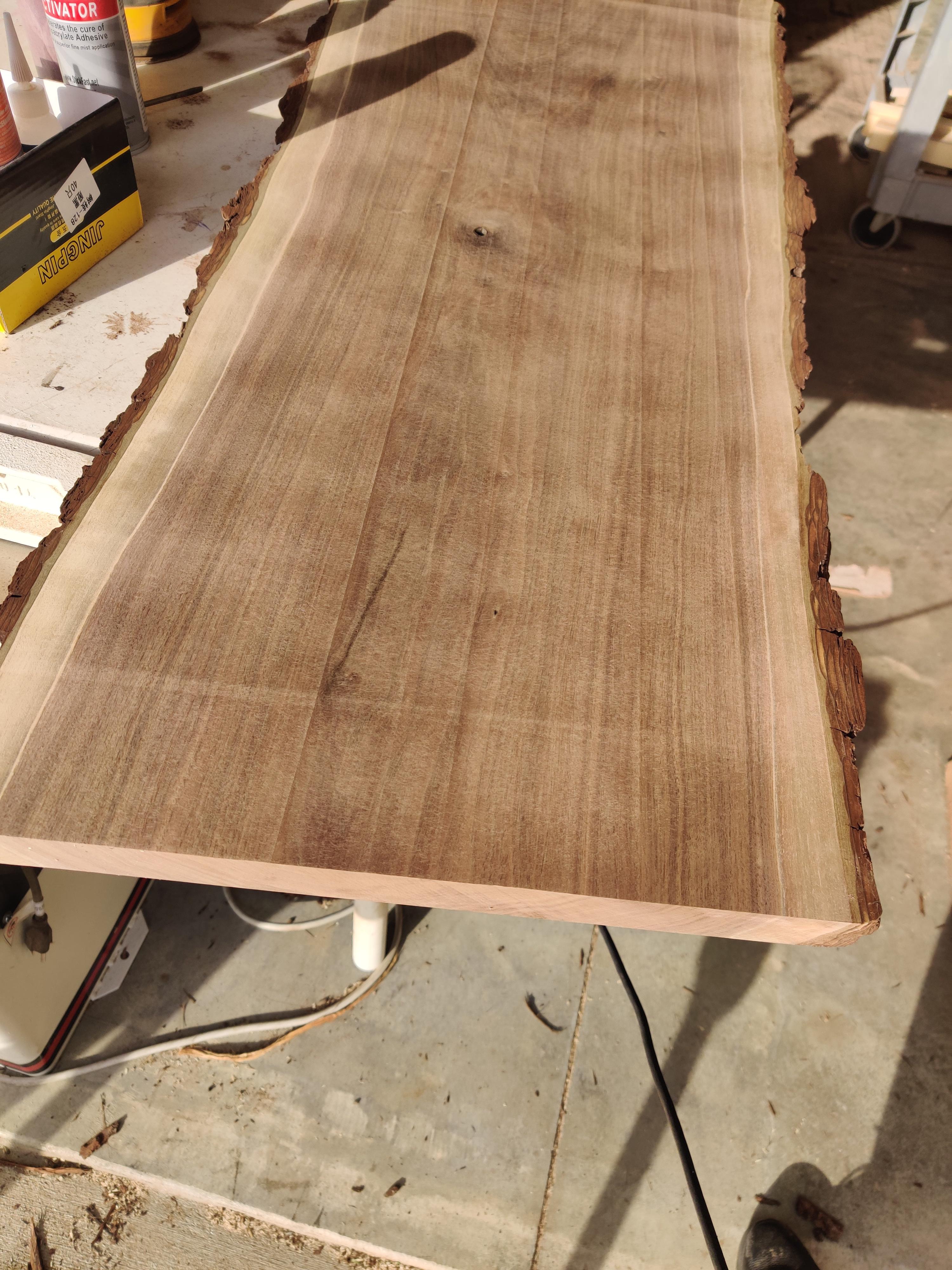 Planer blades leave raised lines vertically across the wood. Anyone