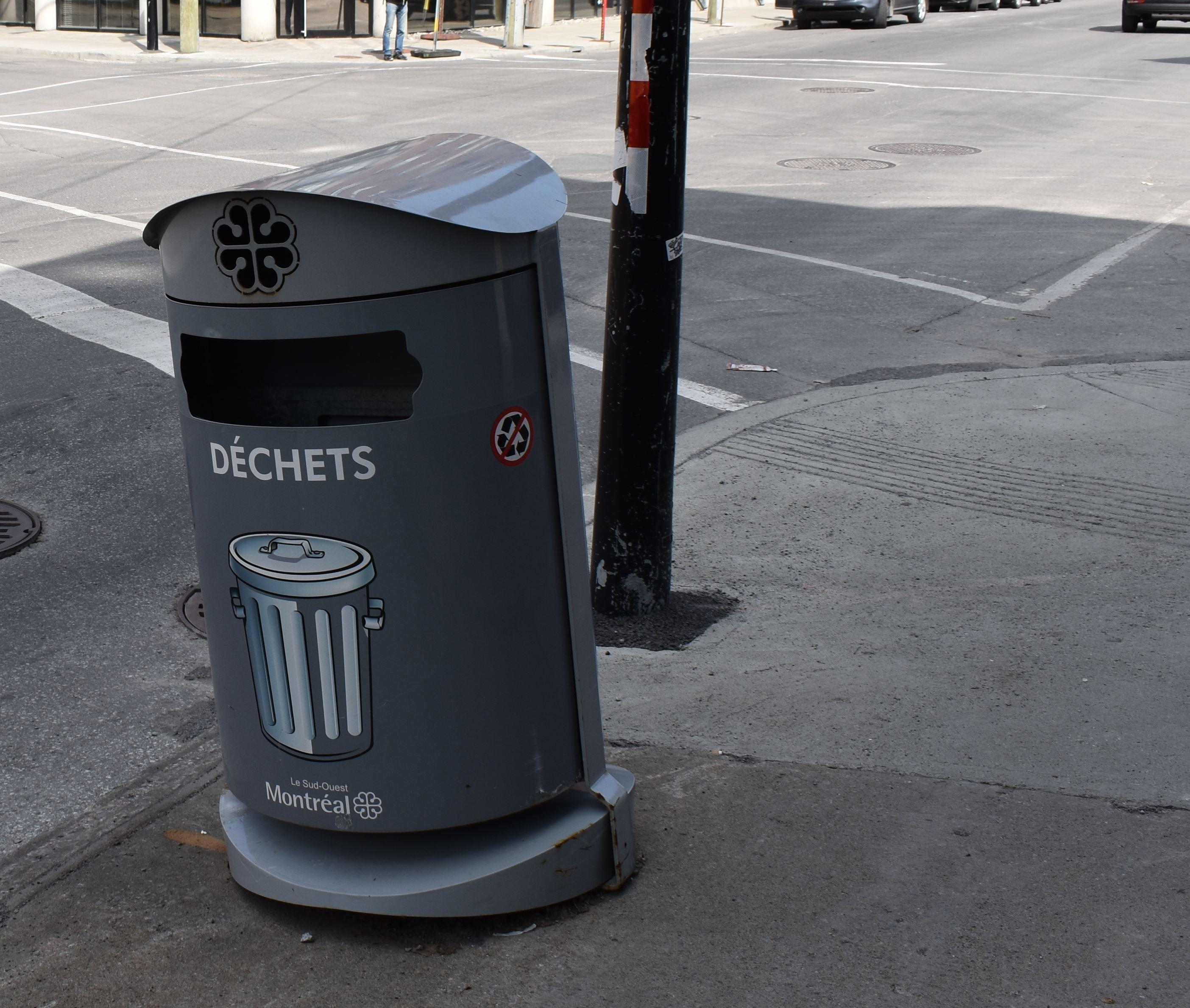 Montreal's fancy trash cans have pictures of ordinary trash cans on