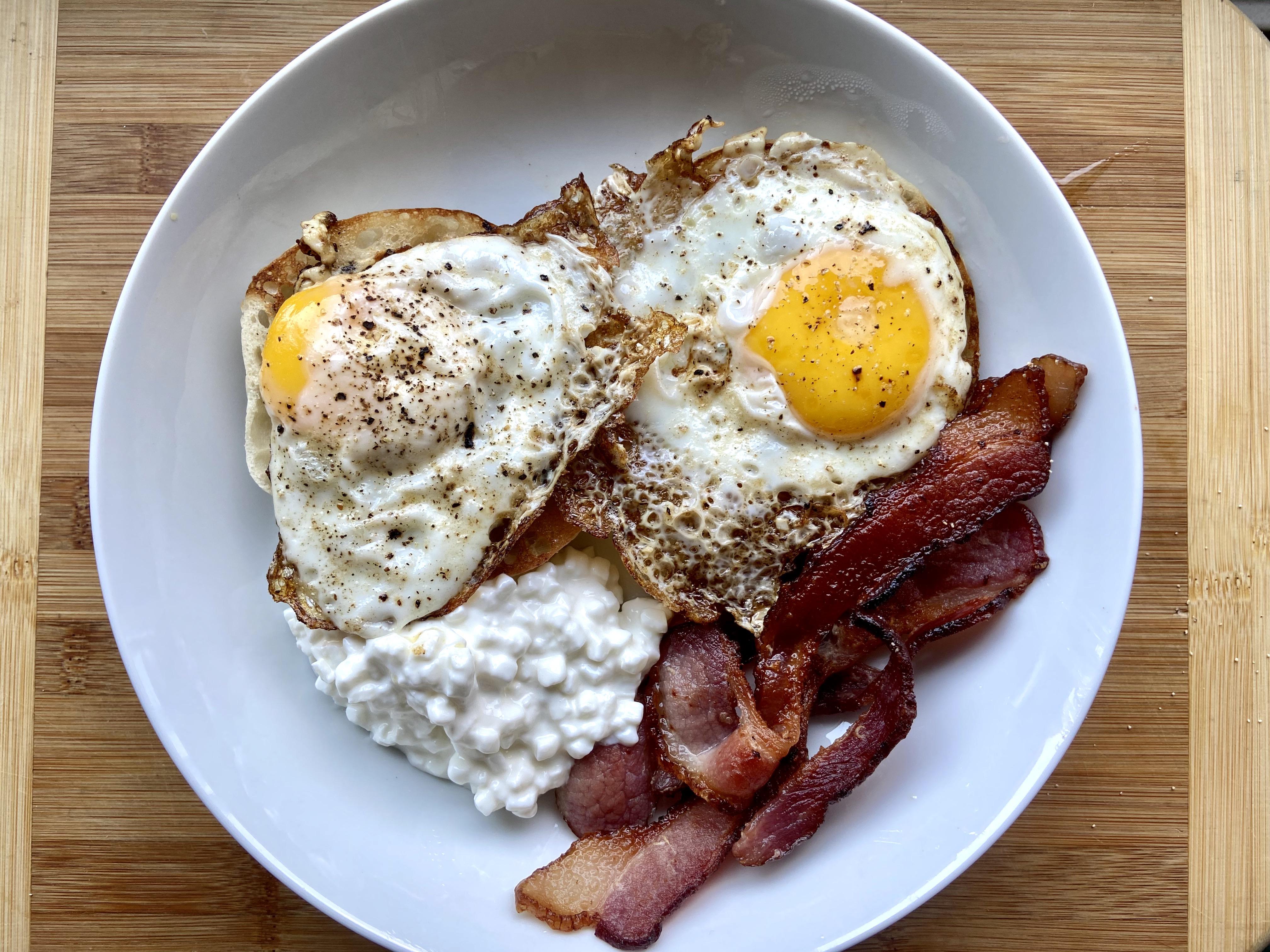 My go to breakfast. Fried eggs, bacon, cottage cheese, and an English