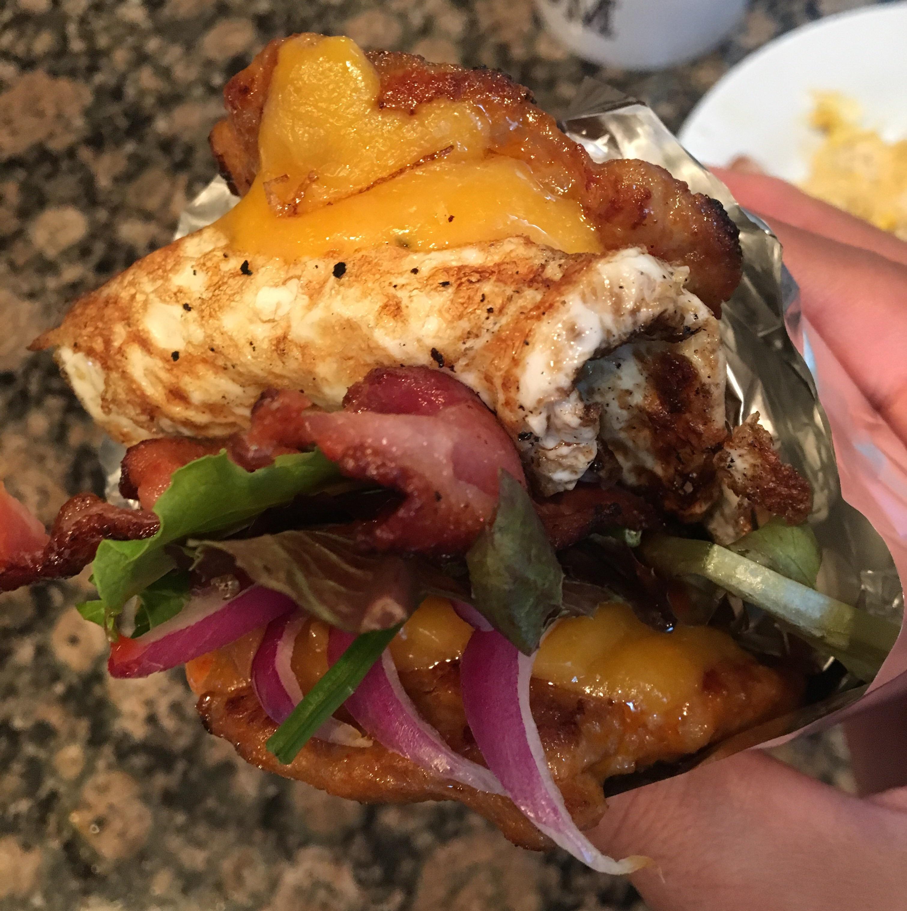 [I made] hot sausage, bacon, egg, and cheese breakfast sandwich r