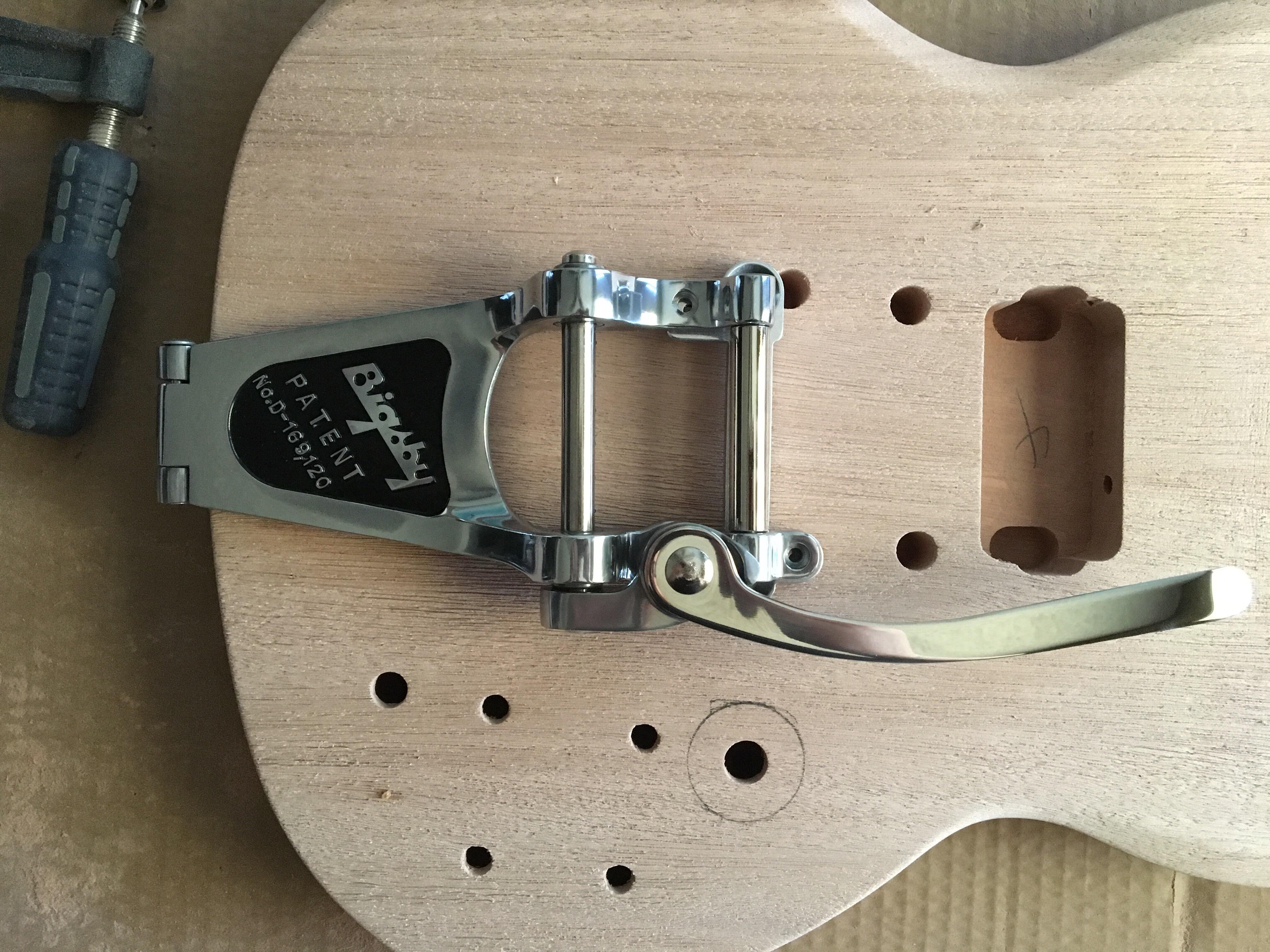 I want to throw a Bigsby B7 on a Solo SG kit but the stop bar holes don