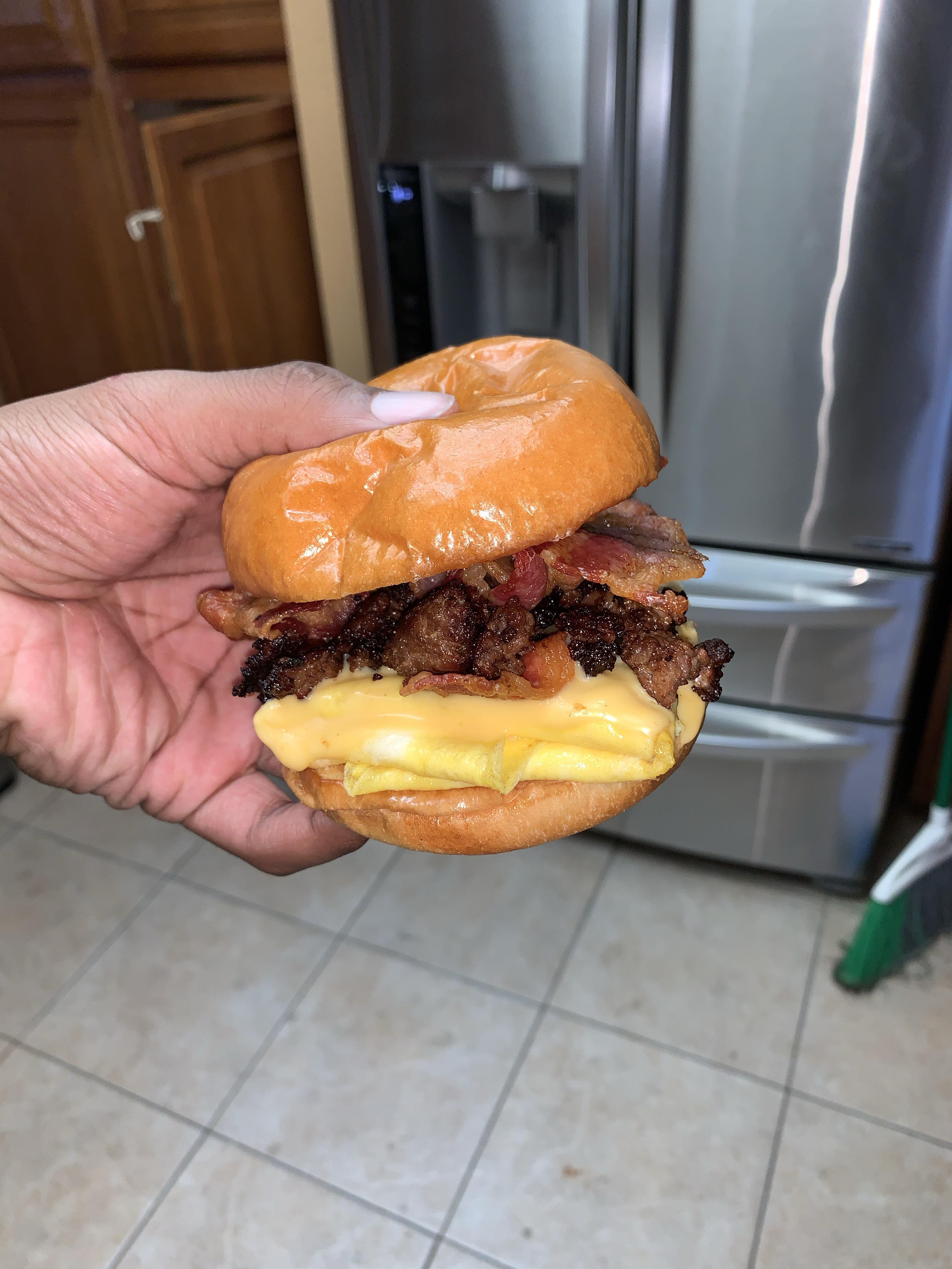 [Homemade] Bacon, sausage, egg, and cheese sandwich on a brioche bun