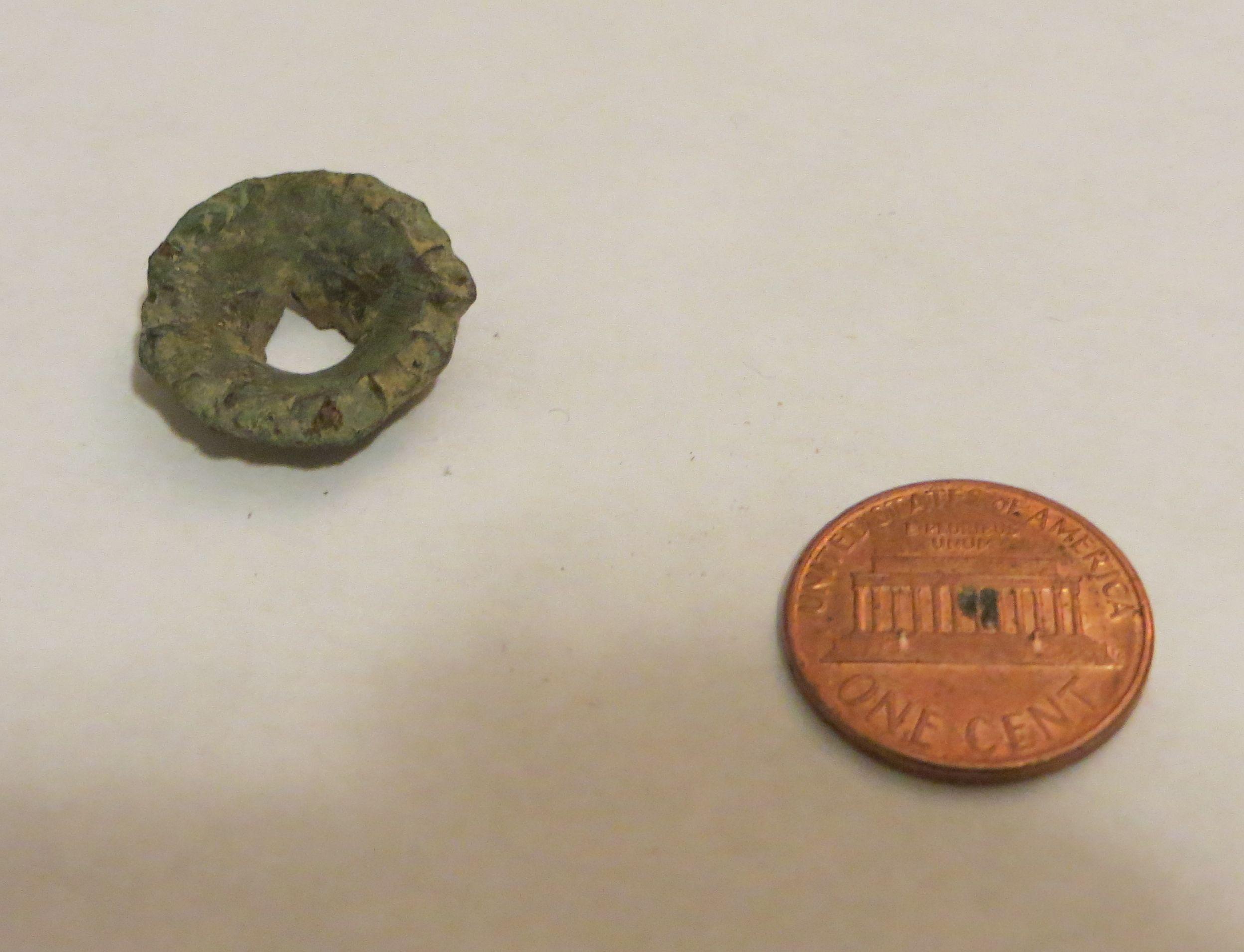 Please help identify this unusual bronze looking artifact found in