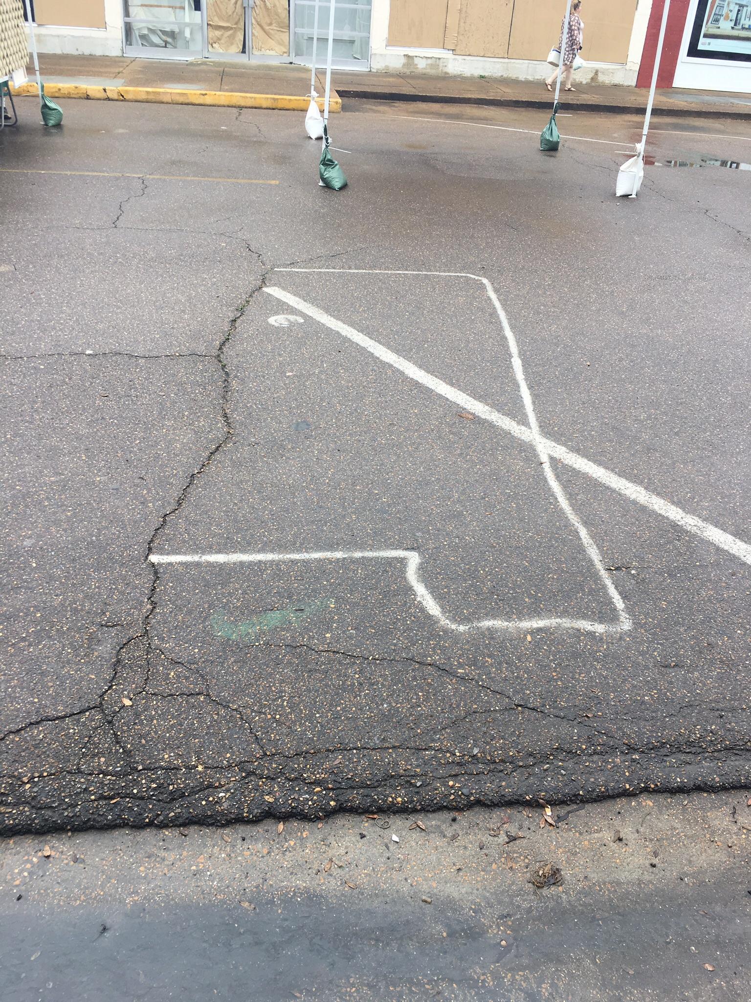 Crack in the road matches the MS river in this parking spot in