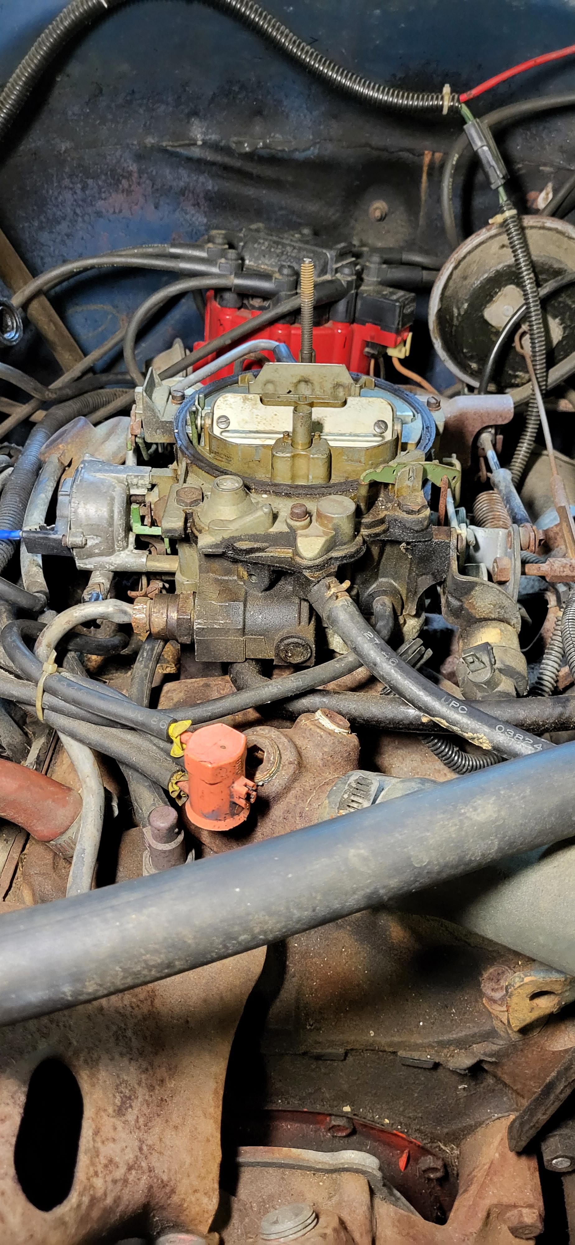 where should I plug my vacuum gauge into to set my idle 1979 gmc c1500