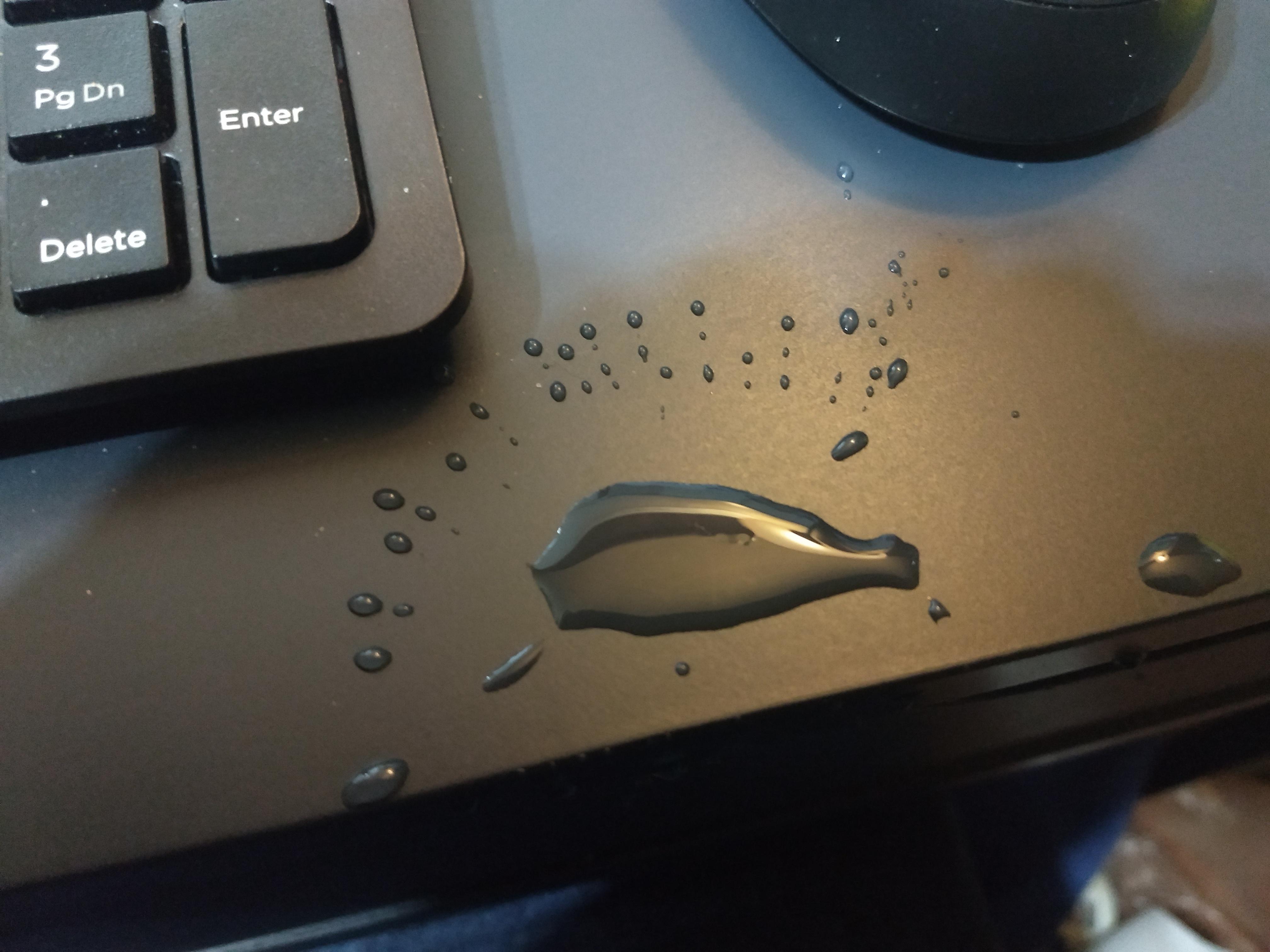 I spilled water on my desk and it looks like a whale splashing water