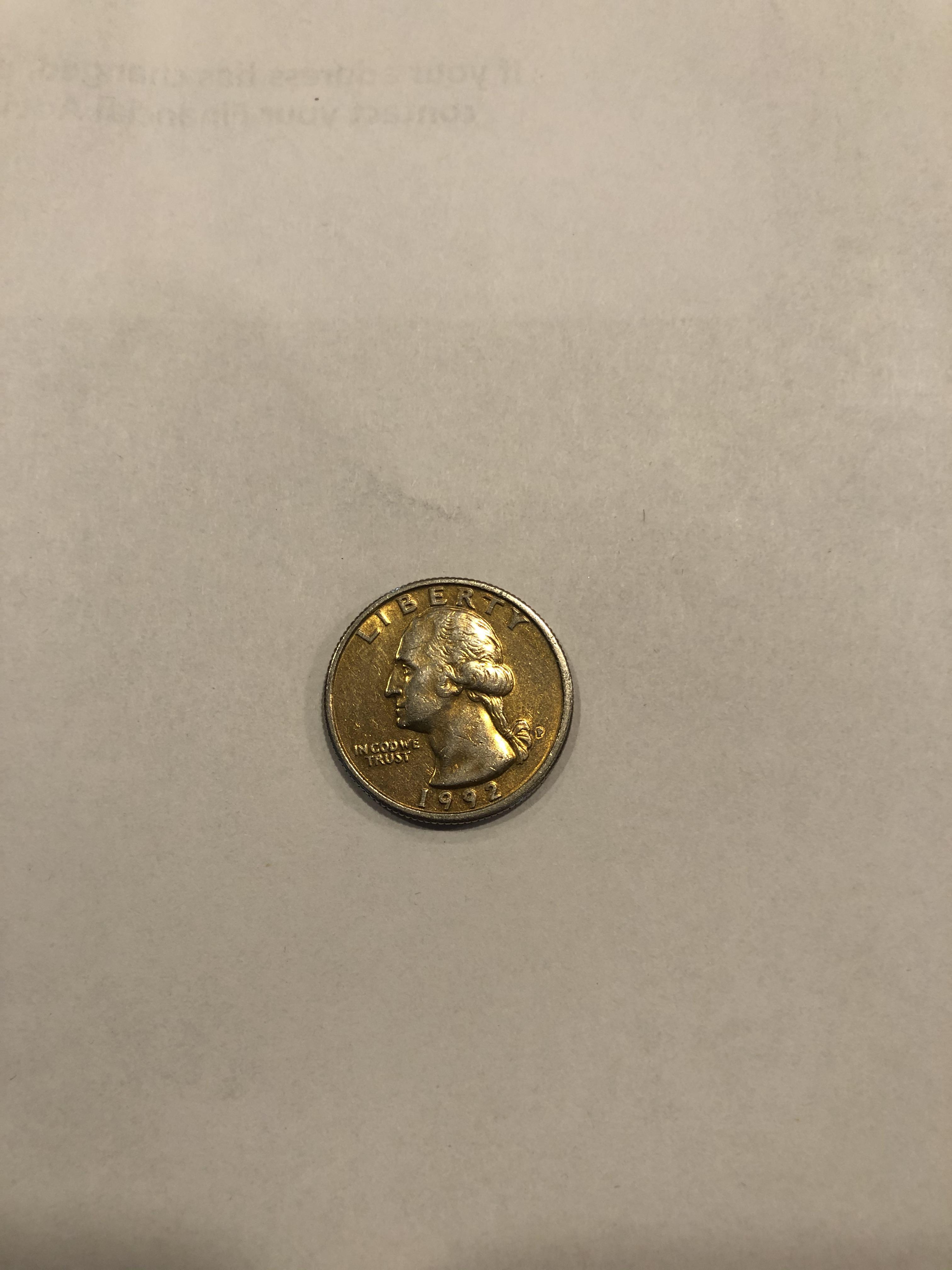 I found this gold colored quarter. Anyone know what the coloring is from? r/coins