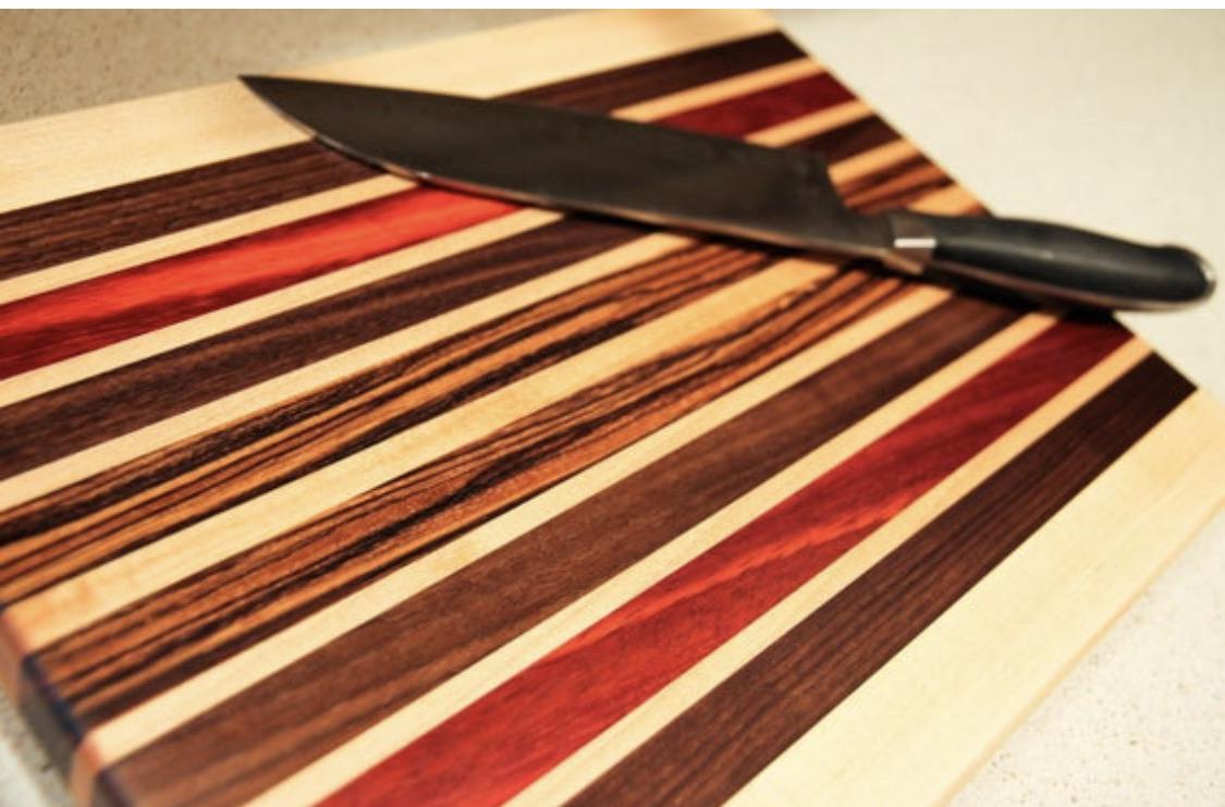 Sugar maple and black walnut cutting board with accents of padauk and