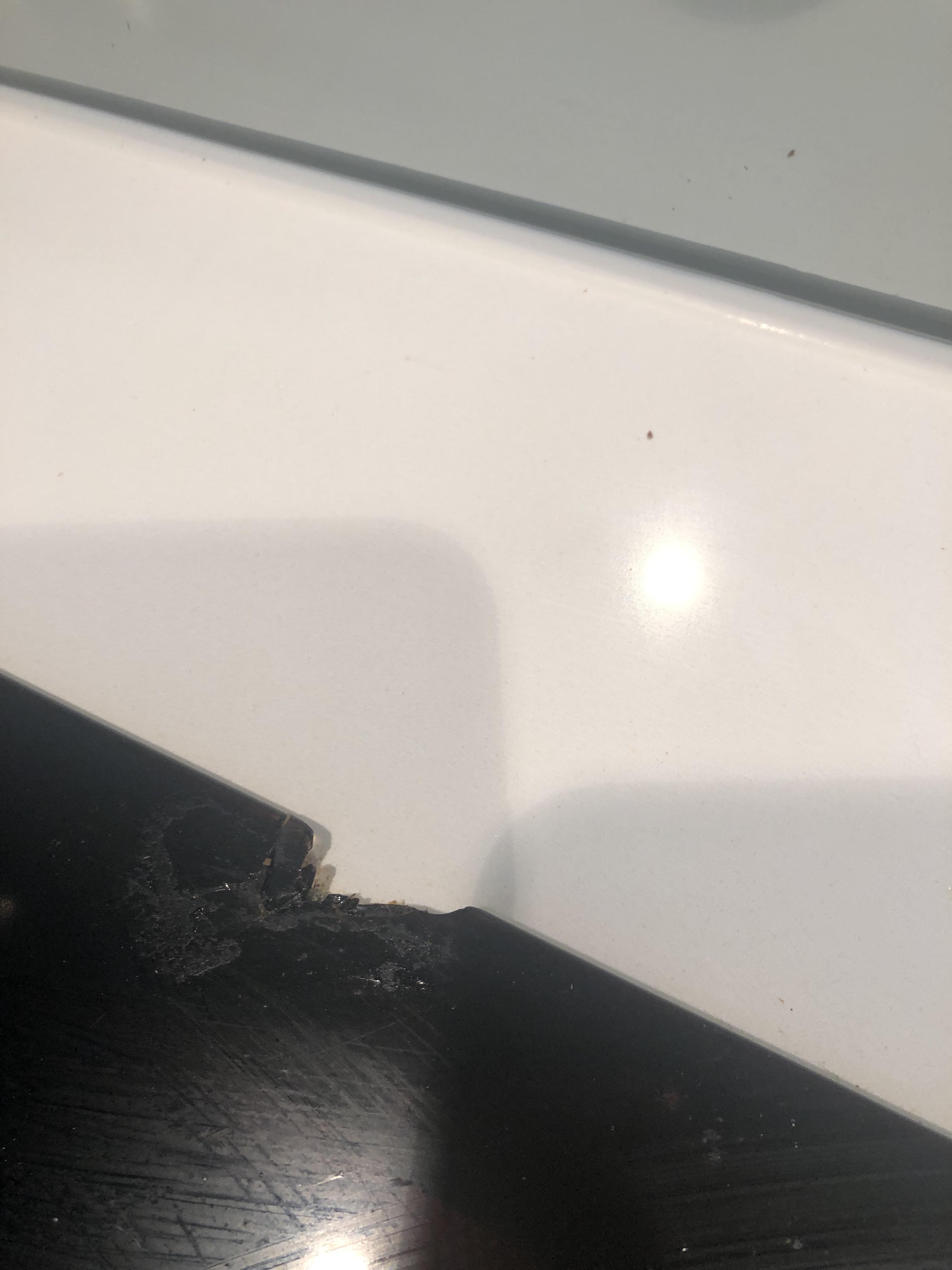 Stovetop chip please help! We dropped a pot and it has chipped our