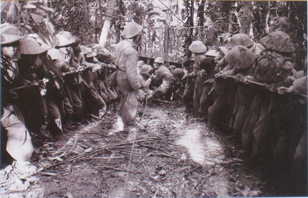 Vietnamese soldiers hauling artillery into the mountains around Dien