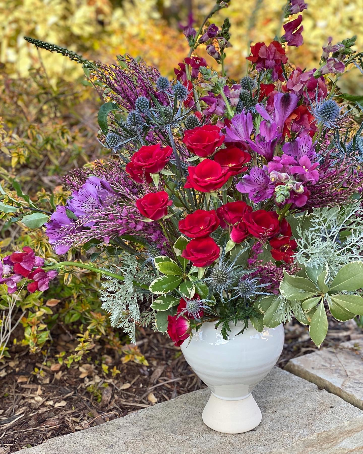 I put this together yesterday from grocery store flowers and backyard