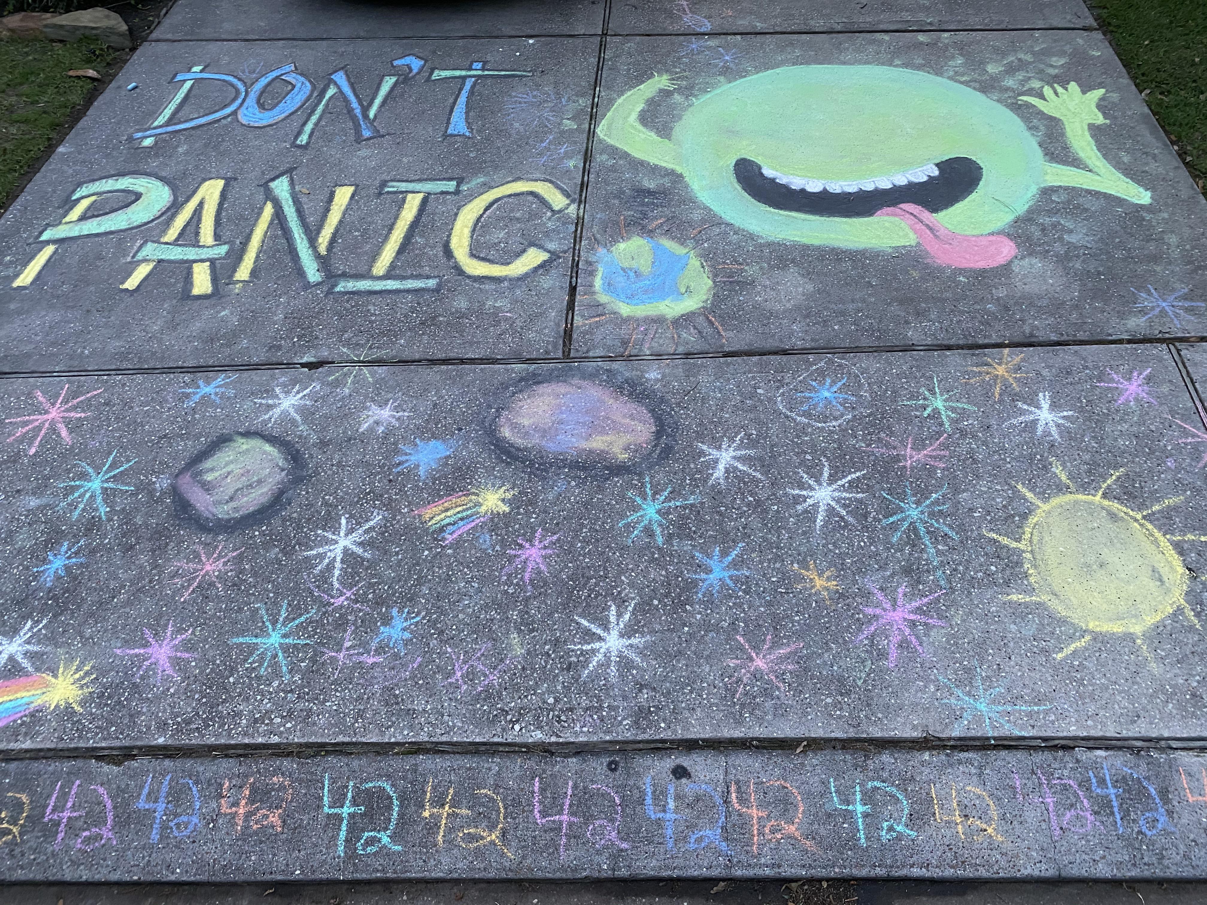 The neighborhood is drawing inspirational sidewalk chalk quotes due to