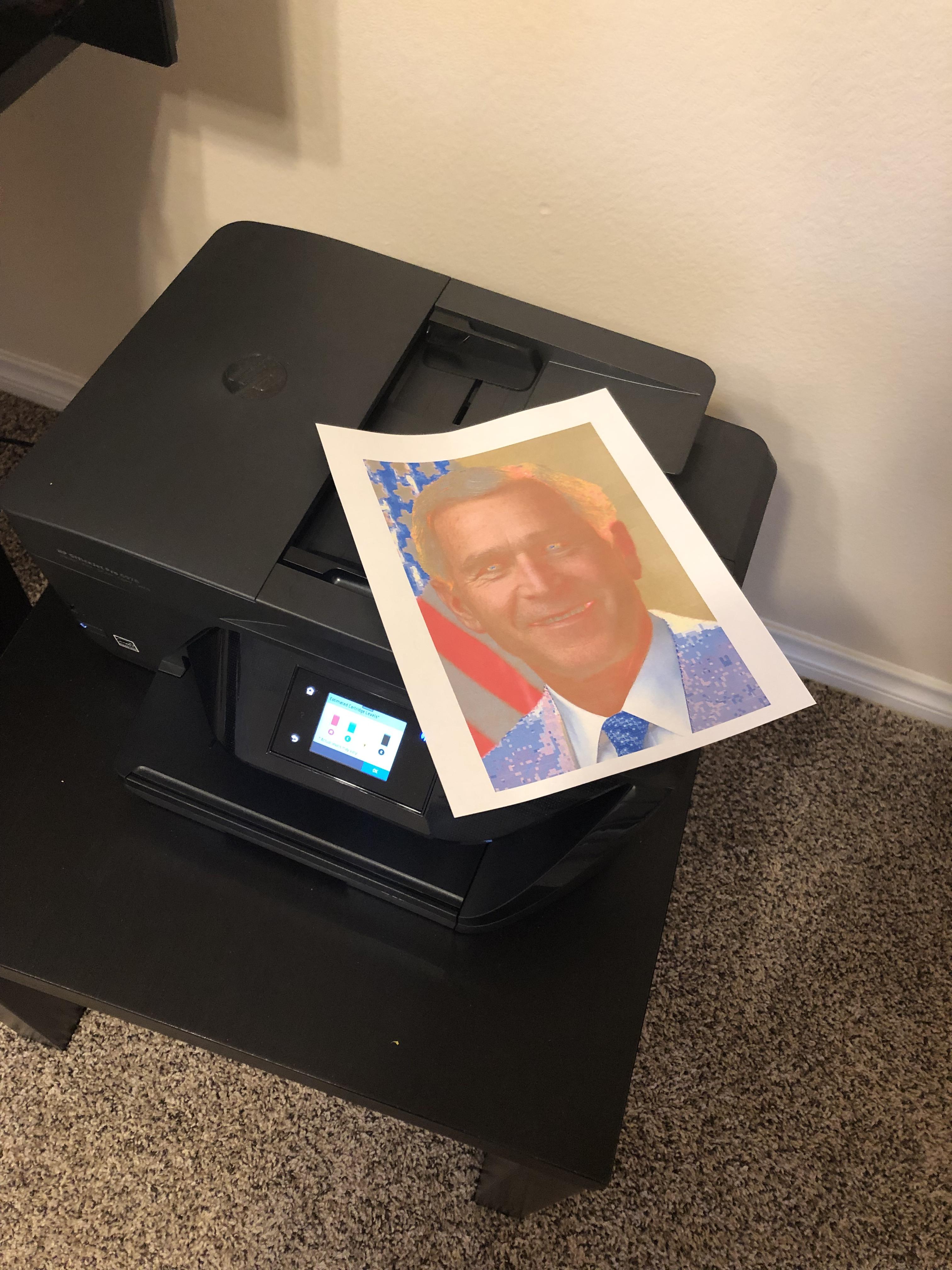 The printer’s ink cartridges are new but the picture of W Bush