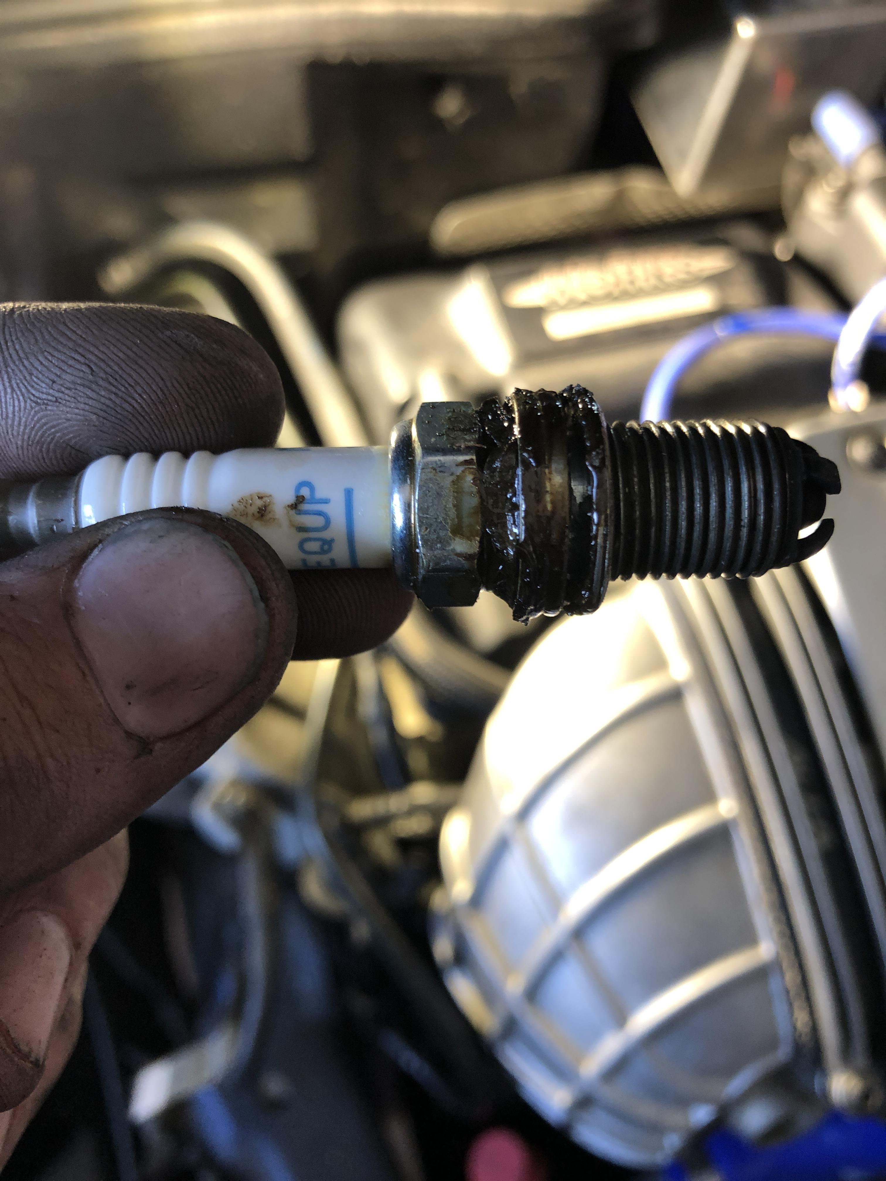 Oil on top of a spark plug. Valve cover gasket? r/MechanicAdvice