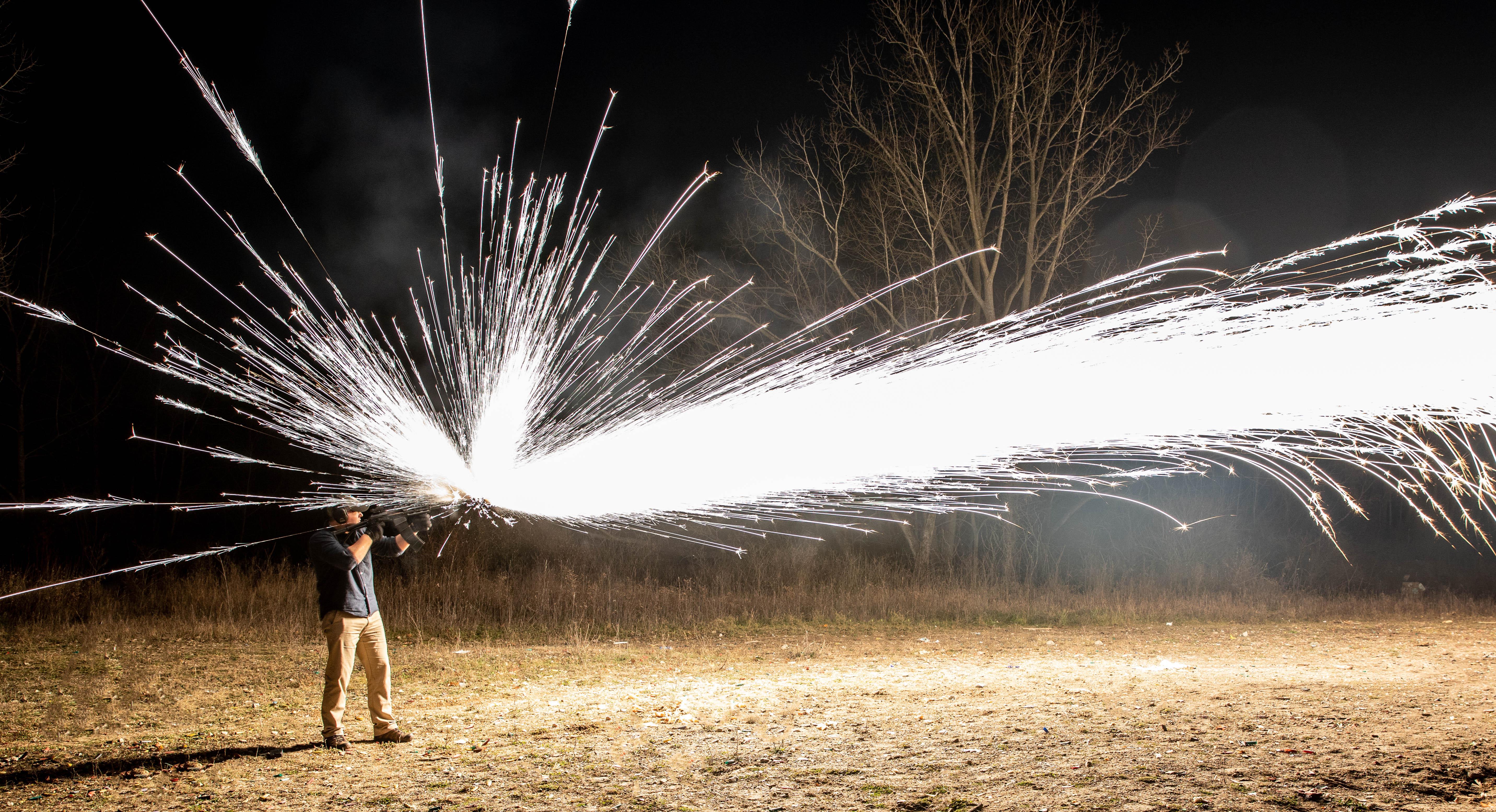 Long exposure of shooting a dragon's breath shotgun shell r/pics